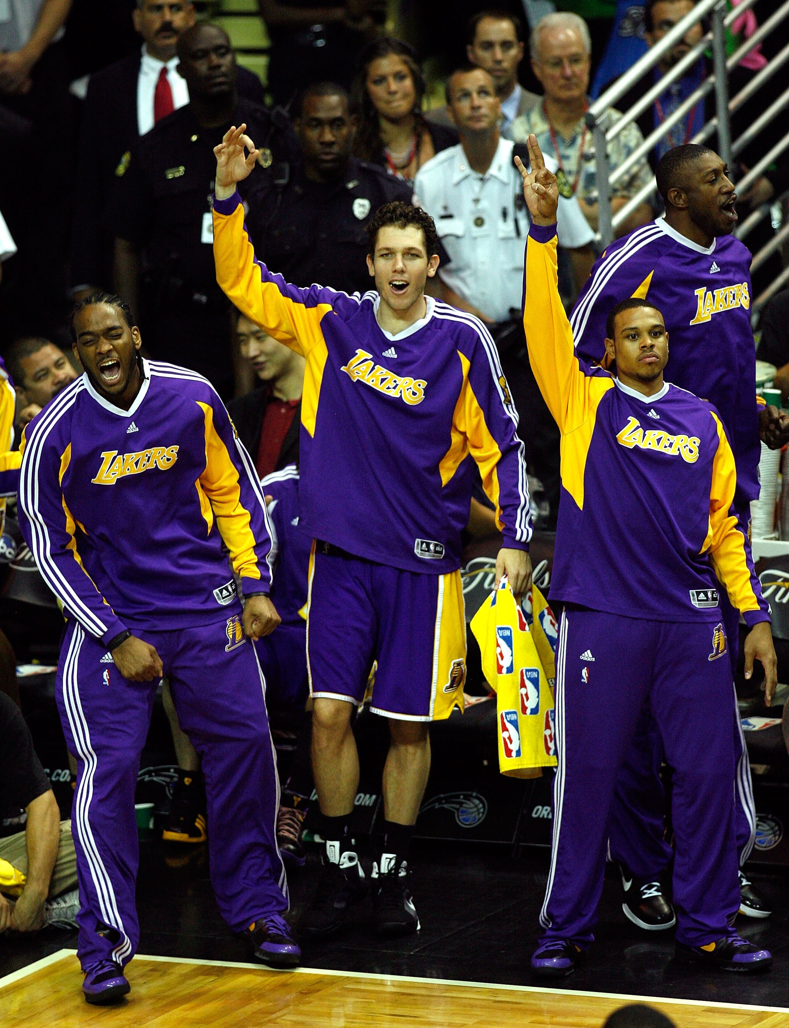 ORLANDO, FL - JUNE 14:  (L-R) Josh Powell #21, Luke Walton #4 and Shannon Brown #12 of the Los Angeles Lakers cheer from the bench in the first half against the Orlando Magic in Game Five of the 2009 NBA Finals on June 14, 2009 at Amway Arena in Orlando,