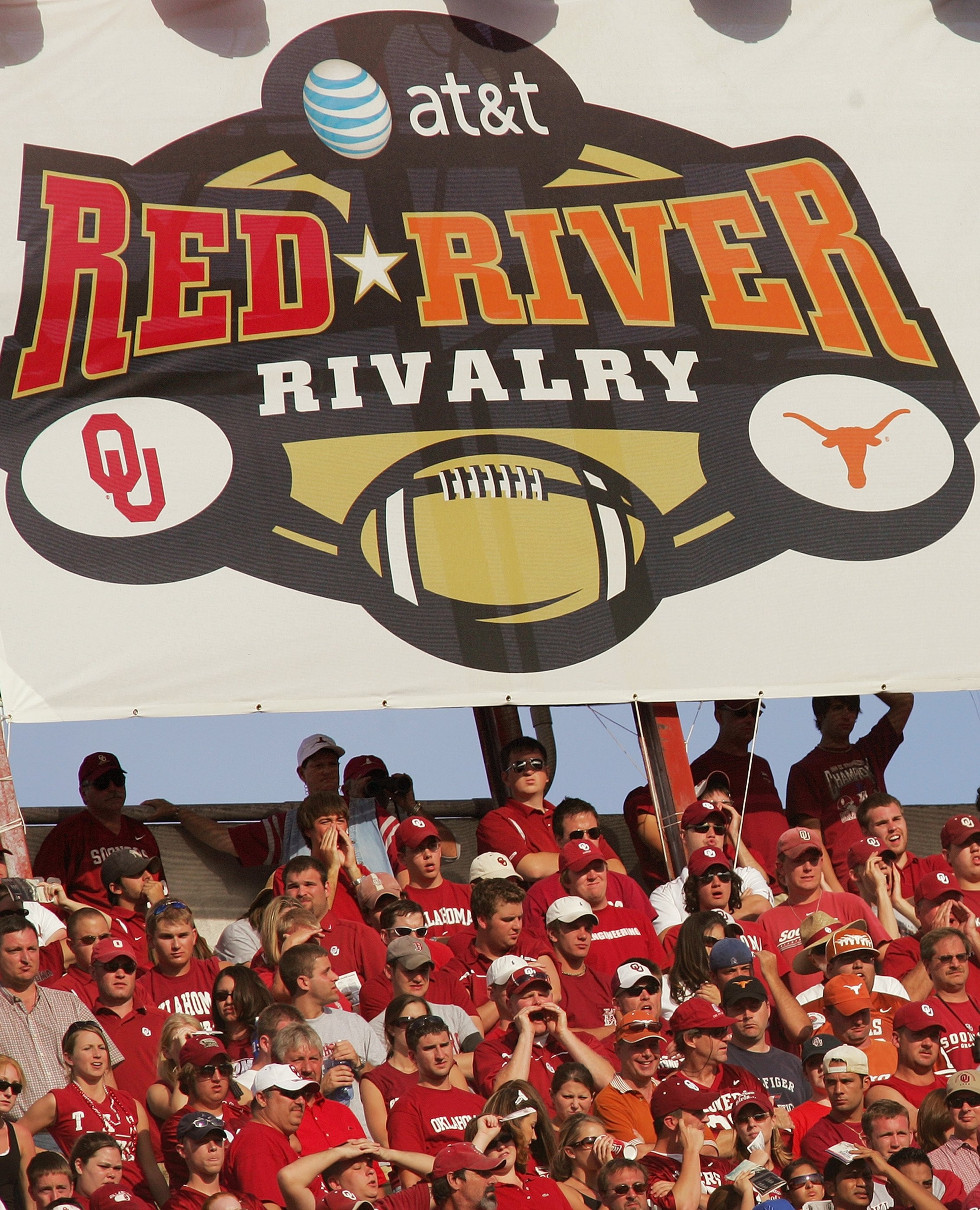 DALLAS - OCTOBER 7: General view of the Rivalry banner hung above fans during the Red River Shootout between the Texas Longhorns and the Oklahoma Sooners at the Cotton Bowl on October 7, 2006 in Dallas, Texas. The Longhorns won 28-10. (Photo by Ronald Ma DALLAS - OCTOBER 7: General view of the Rivalry banner hung above fans during the Red River Shootout between the Texas Longhorns and the Oklahoma Sooners at the Cotton Bowl on October 7, 2006 in Dallas, Texas. The Longhorns won 28-10. (Photo by Ronald Ma