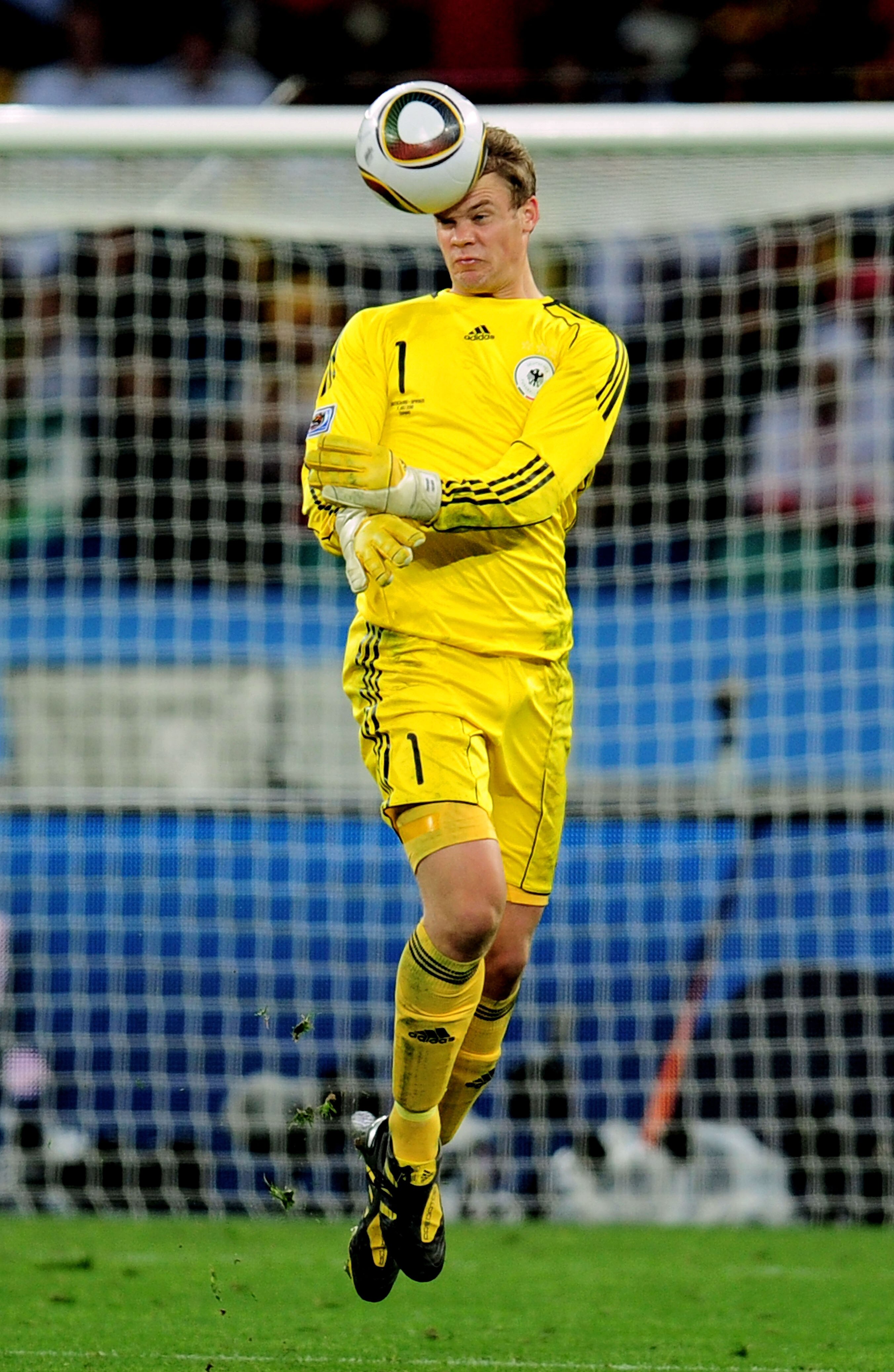 DURBAN, SOUTH AFRICA - JULY 07:  Manuel Neuer of Germany heads the ball during the 2010 FIFA World Cup South Africa Semi Final match between Germany and Spain at Durban Stadium on July 7, 2010 in Durban, South Africa.  (Photo by Clive Mason/Getty Images)