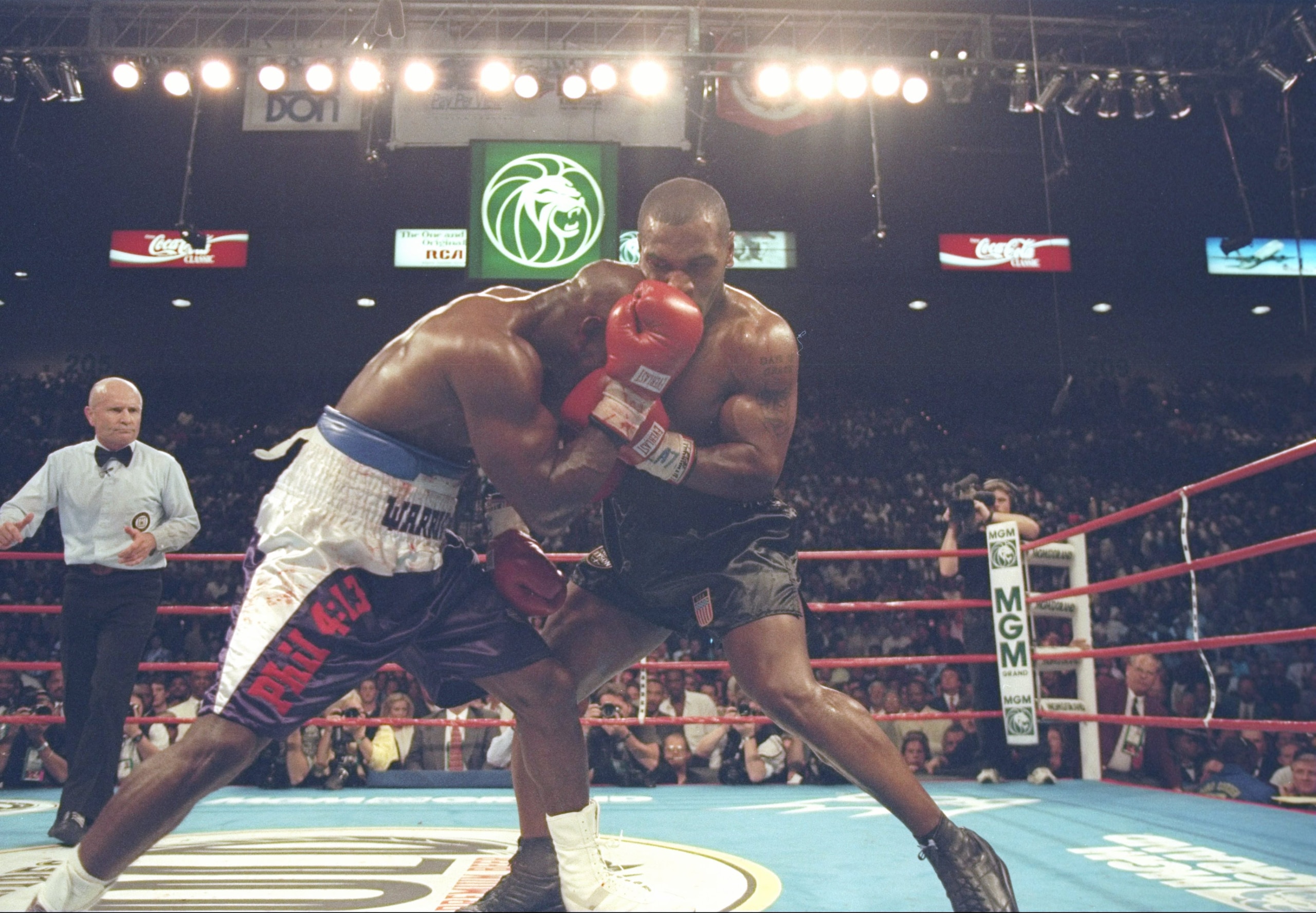 28 Jun 1997:  Evander Holyfield and Mike Tyson grapple during their bout at the MGM Grand Garden in Las Vegas, Nevada.  Holyfield won the fight with a disqualification in the third round. Mandatory Credit: Jed Jacobsohn  /Allsport