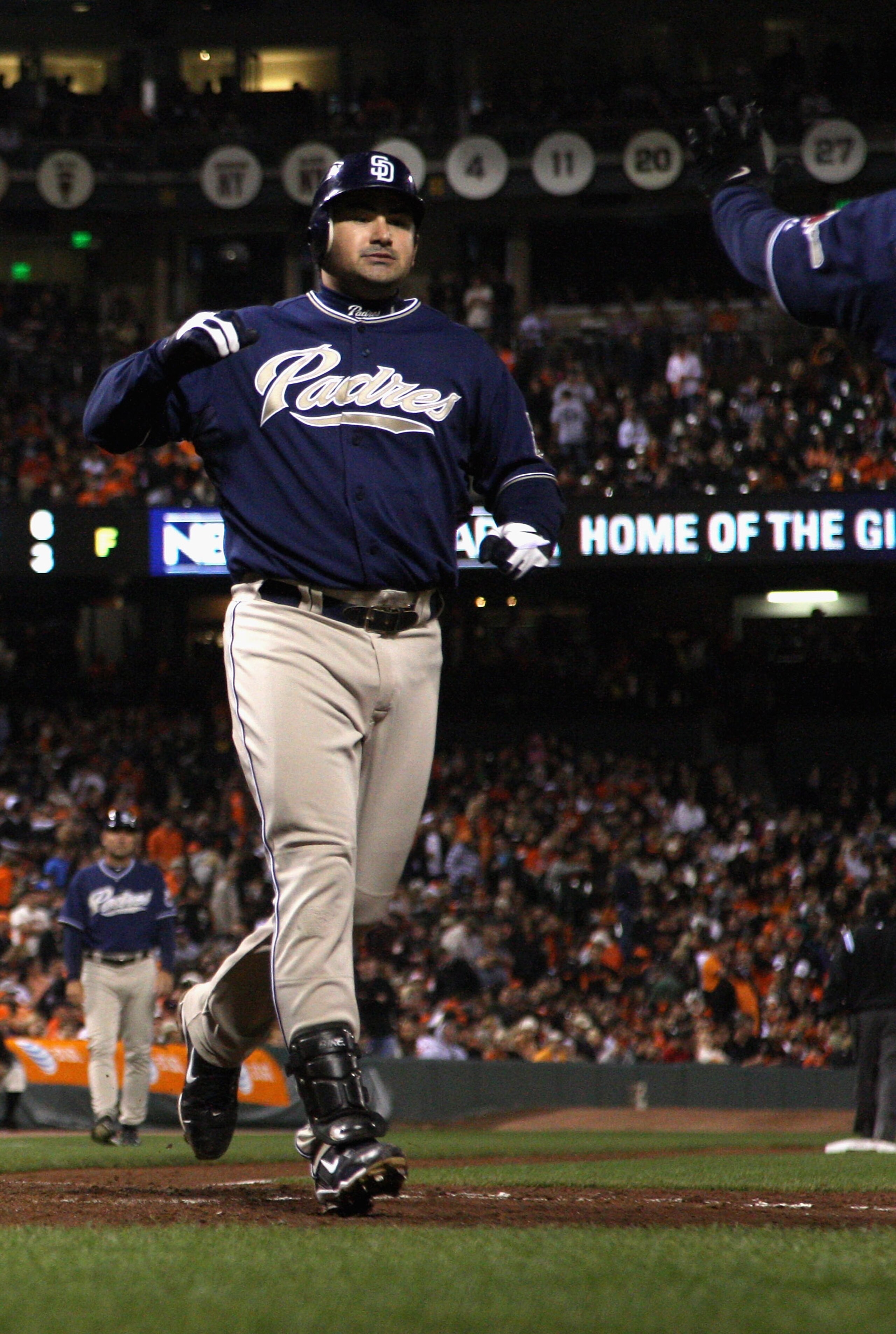 SAN FRANCISCO - OCTOBER 01:  Adrain Gonzalez #23 of the San Diego Padres crosses home plate after he hit a three-run home run to give the Padres a 4-0 lead over the San Francisco Giants in the third inning at AT&T Park on October 1, 2010 in San Francisco,