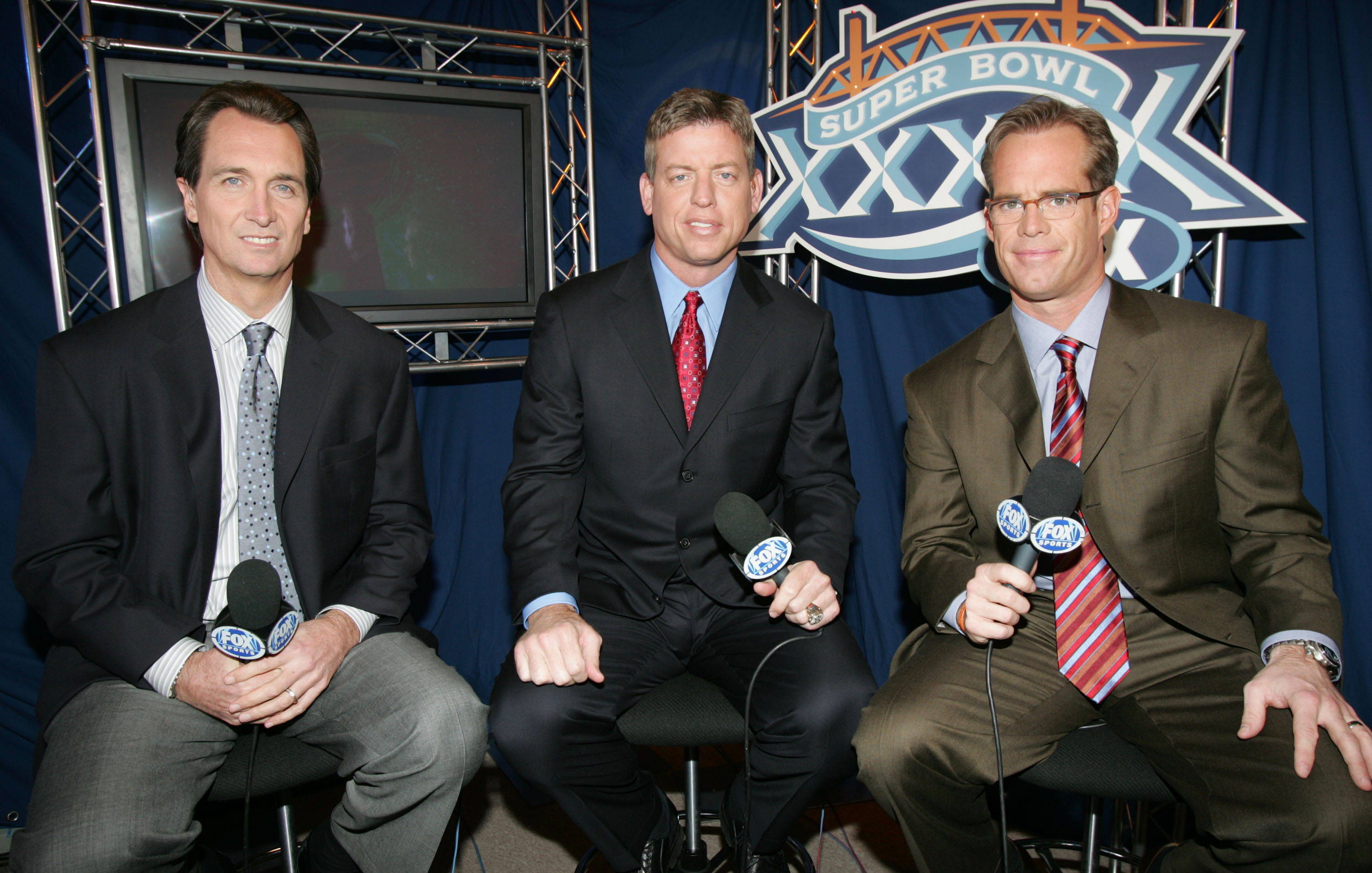 JACKSONVILLE, FL - FEBRUARY 06:  (L-R) FOX game broadcasters Cris Collinsworth, Troy Aiken and Joe Buck during the XXXIX Superbowl pregame show at Alltel Stadium on February 6, 2005 in Jacksonville, Florida.  (Photo by Frank Micelotta/Getty Images)