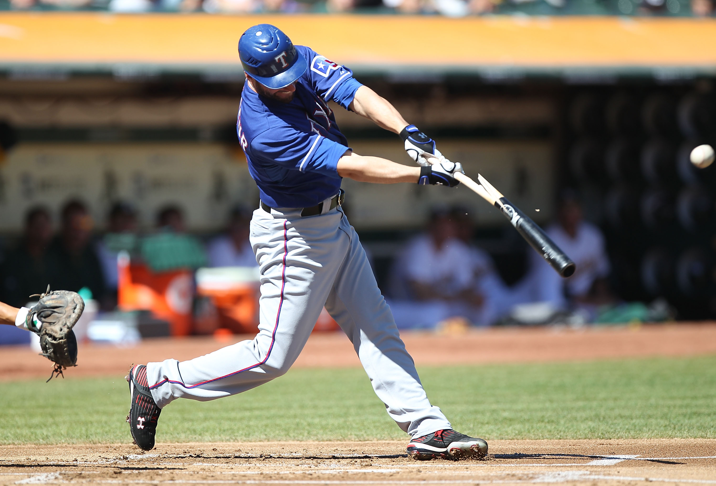 OAKLAND, CA - SEPTEMBER 26:  Jeff Francoeur #21 of the Texas Rangers hits an RBI single against the Oakland Athletics during a Major League Baseball game at the Oakland-Alameda County Coliseum on September 26, 2010 in Oakland, California.  (Photo by Jed J