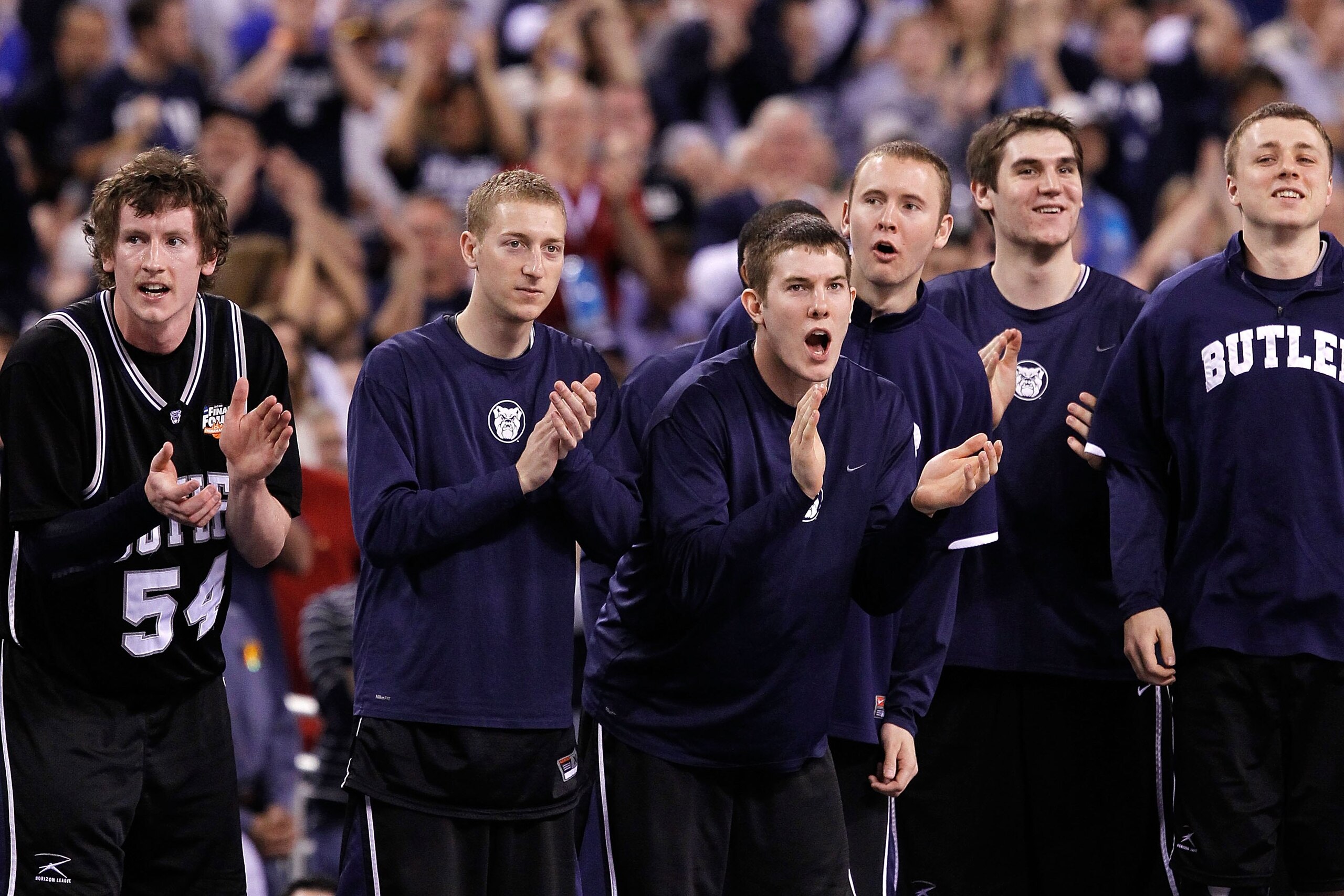 INDIANAPOLIS - APRIL 05:  Matt Howard #54 (L) of the Butler Bulldogs supports his teammates along with other players on the bench against the Duke Blue Devils during the 2010 NCAA Division I Men's Basketball National Championship game at Lucas Oil Stadium