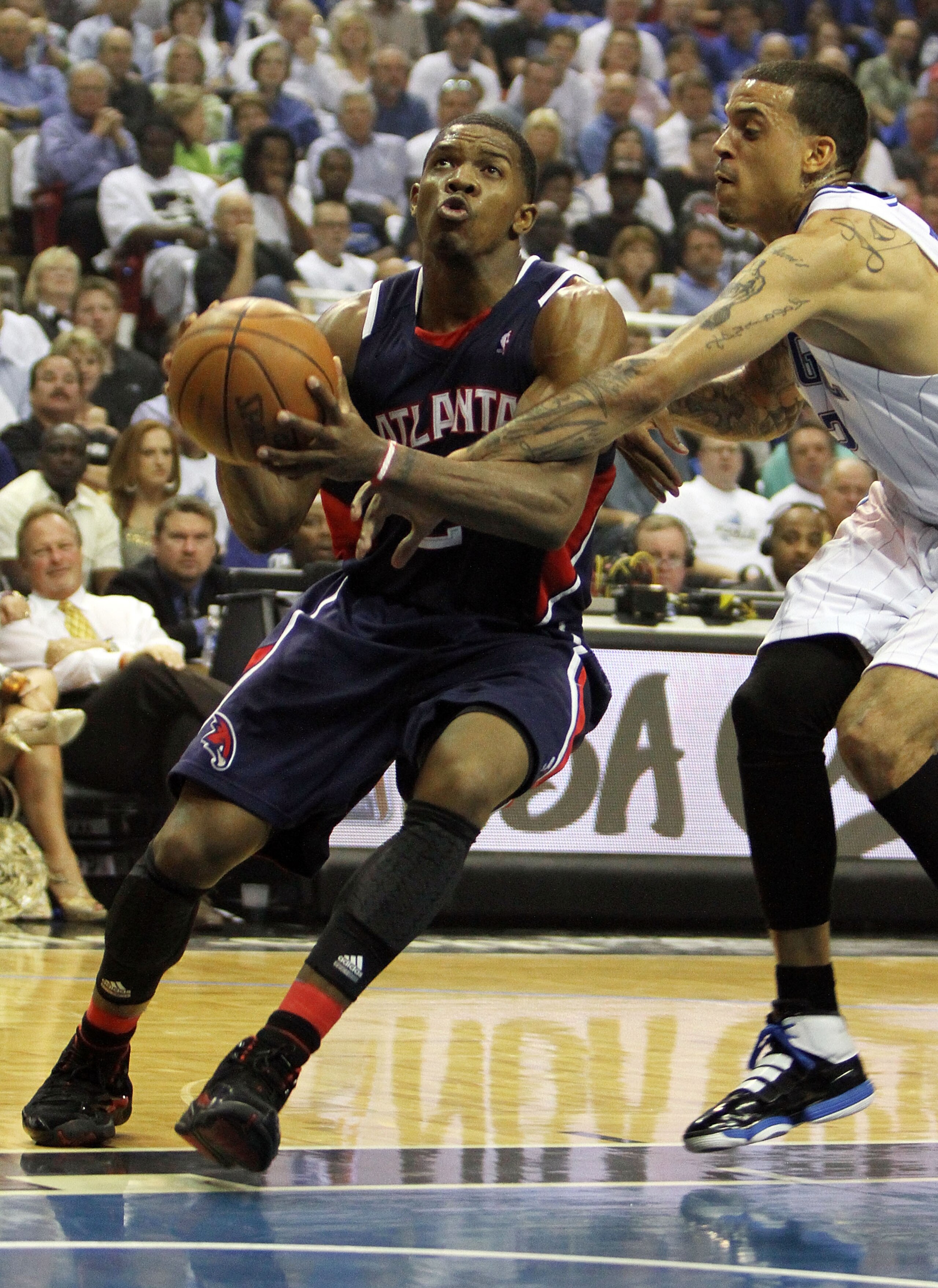 ORLANDO, FL - MAY 04:  Joe Johnson #2 of the Atlanta Hawks drives past Matt Barnes #22 of the Orlando Magic in Game One of the Eastern Conference Semifinals during the 2010 NBA Playoffs at Amway Arena on May 4, 2010 in Orlando, Florida. NOTE TO USER: User