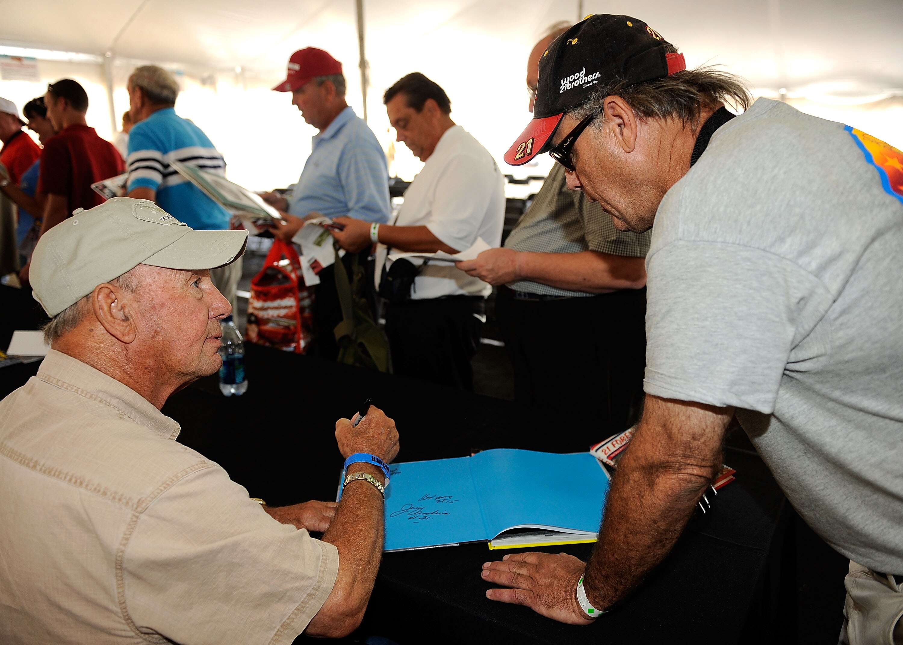 DARLINGTON, SC - SEPTEMBER 25:  Charlie Glotzbach signs autographs during the Darlington Historic Racing Festival at Darlington Raceway on September 25, 2010 in Darlington, South Carolina.  (Photo by Rusty Jarrett/Getty Images)