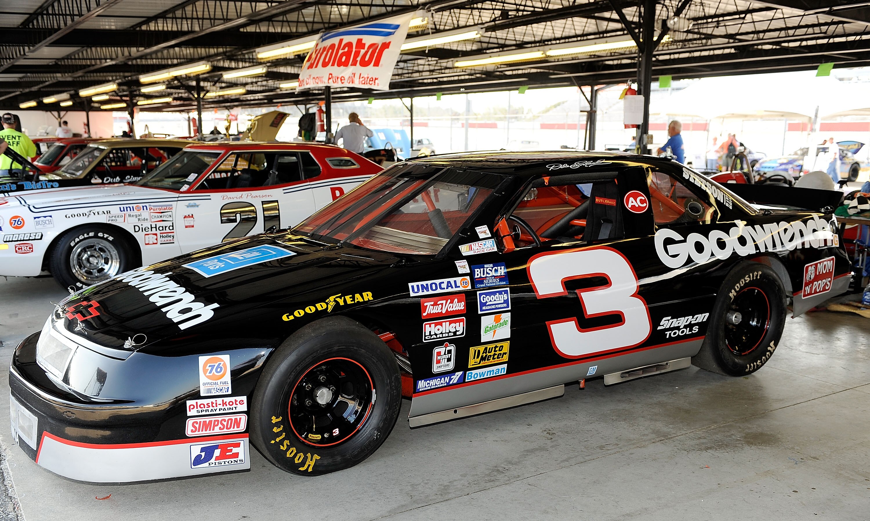 DARLINGTON, SC - SEPTEMBER 25:  Vintage stock cars on display in the garage area during the Darlington Historic Racing Festival at Darlington Raceway on September 25, 2010 in Darlington, South Carolina.  (Photo by Rusty Jarrett/Getty Images)