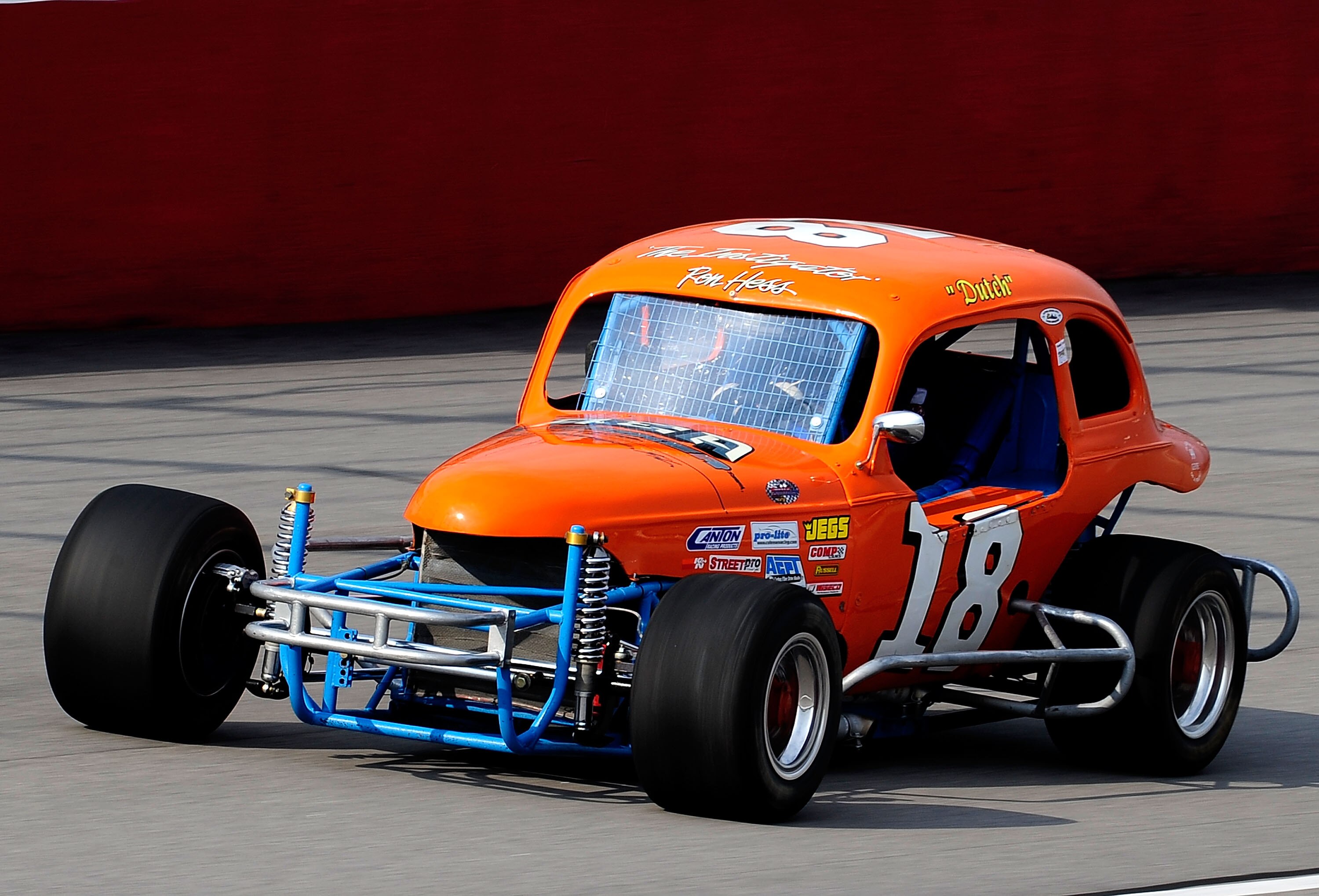 DARLINGTON, SC - SEPTEMBER 26:  Vintage stock cars drive down the front straight during the Darlington Historic Racing Festival at Darlington Raceway on September 26, 2010 in Darlington, South Carolina.  (Photo by Rusty Jarrett/Getty Images)