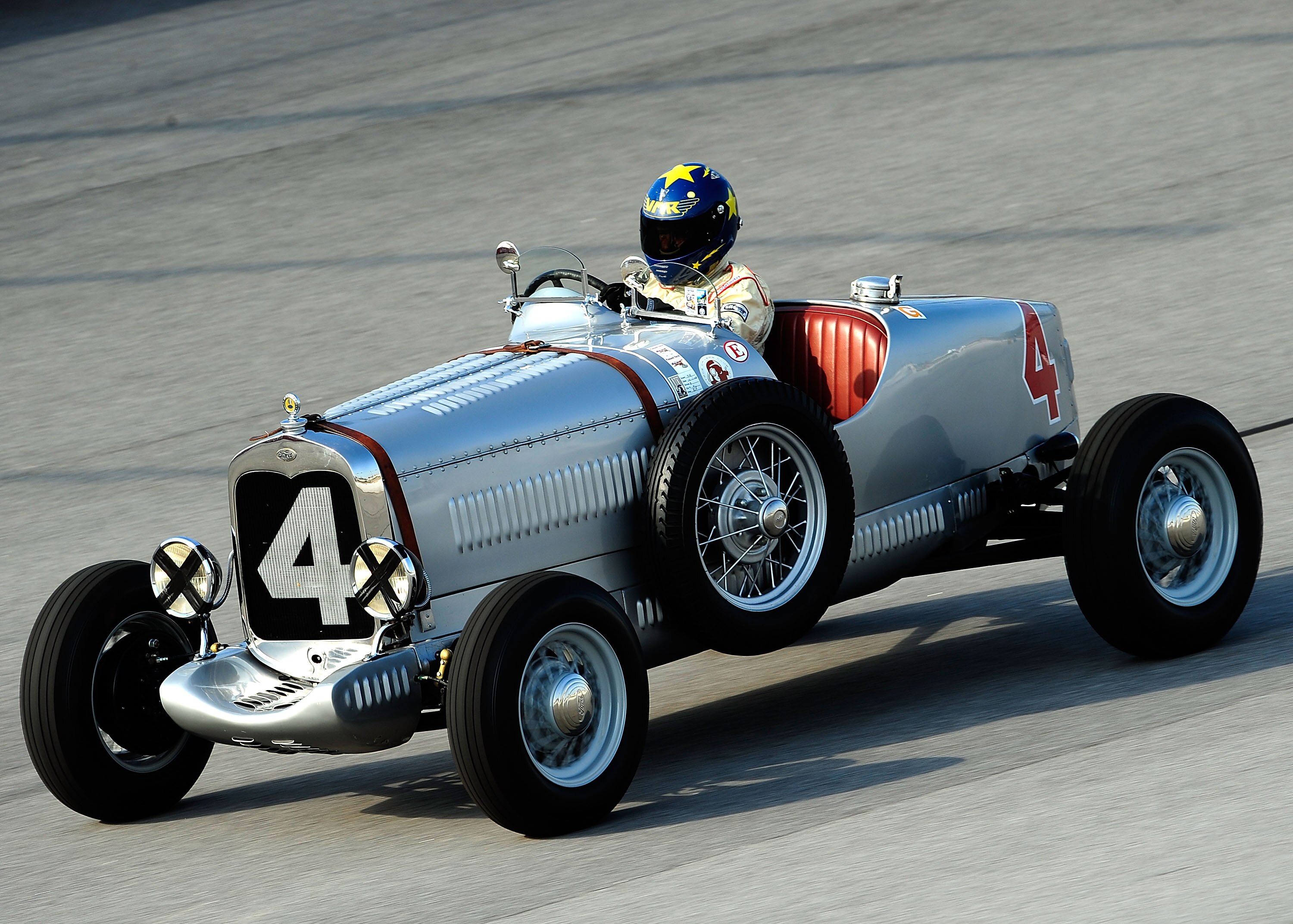DARLINGTON, SC - SEPTEMBER 25:  Vintage cars drive during the Darlington Historic Racing Festival at Darlington Raceway on September 25, 2010 in Darlington, South Carolina.  (Photo by Rusty Jarrett/Getty Images)