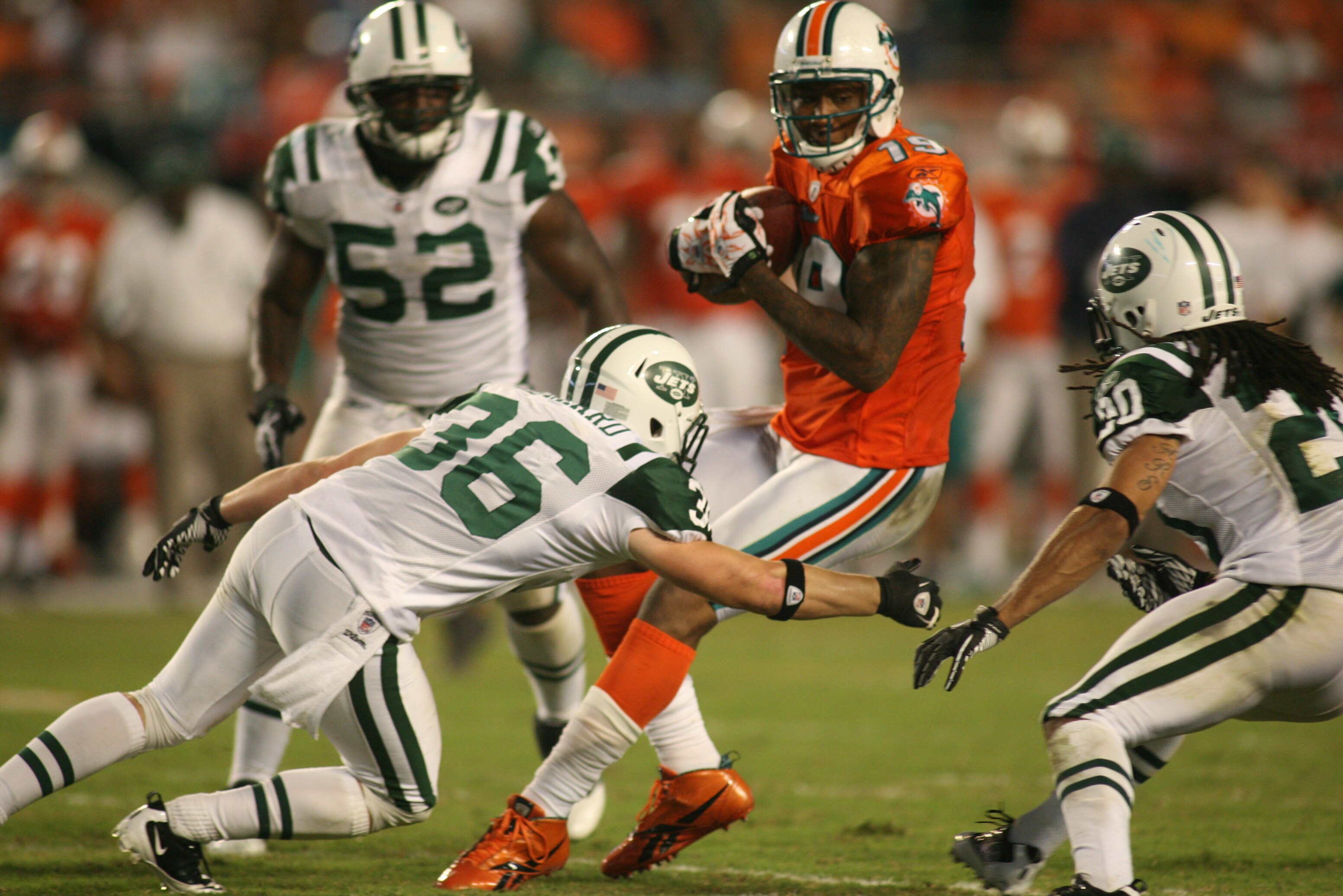 MIAMI - SEPTEMBER 26: Receiver Brandon Marshall #19 of the Miami Dolphins makes a catch against the New York Jets at Sun Life Stadium on September 26, 2010 in Miami, Florida. The Jets won 31-23. (Photo by Marc Serota/Getty Images)