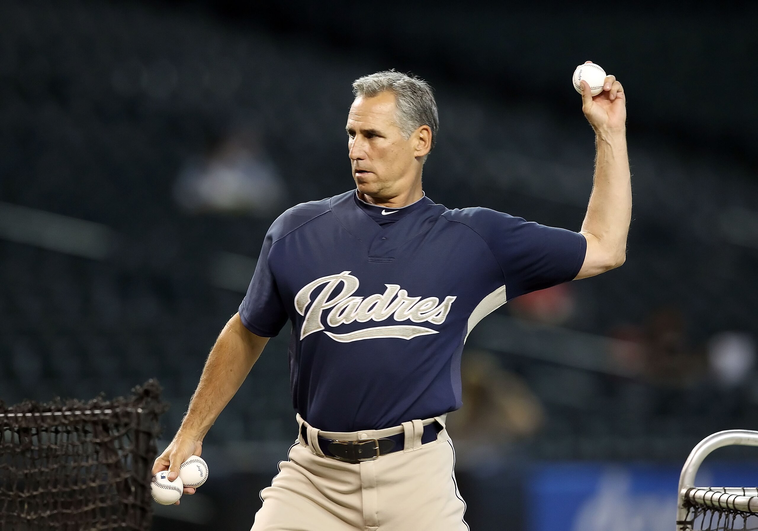 PHOENIX - AUGUST 30:  Manager Bud Black of the San Diego Padres throws batting practice before the Major League Baseball game against the Arizona Diamondbacks at Chase Field on August 30, 2010 in Phoenix, Arizona.   The Diamondbacks defeated the Padres 7-