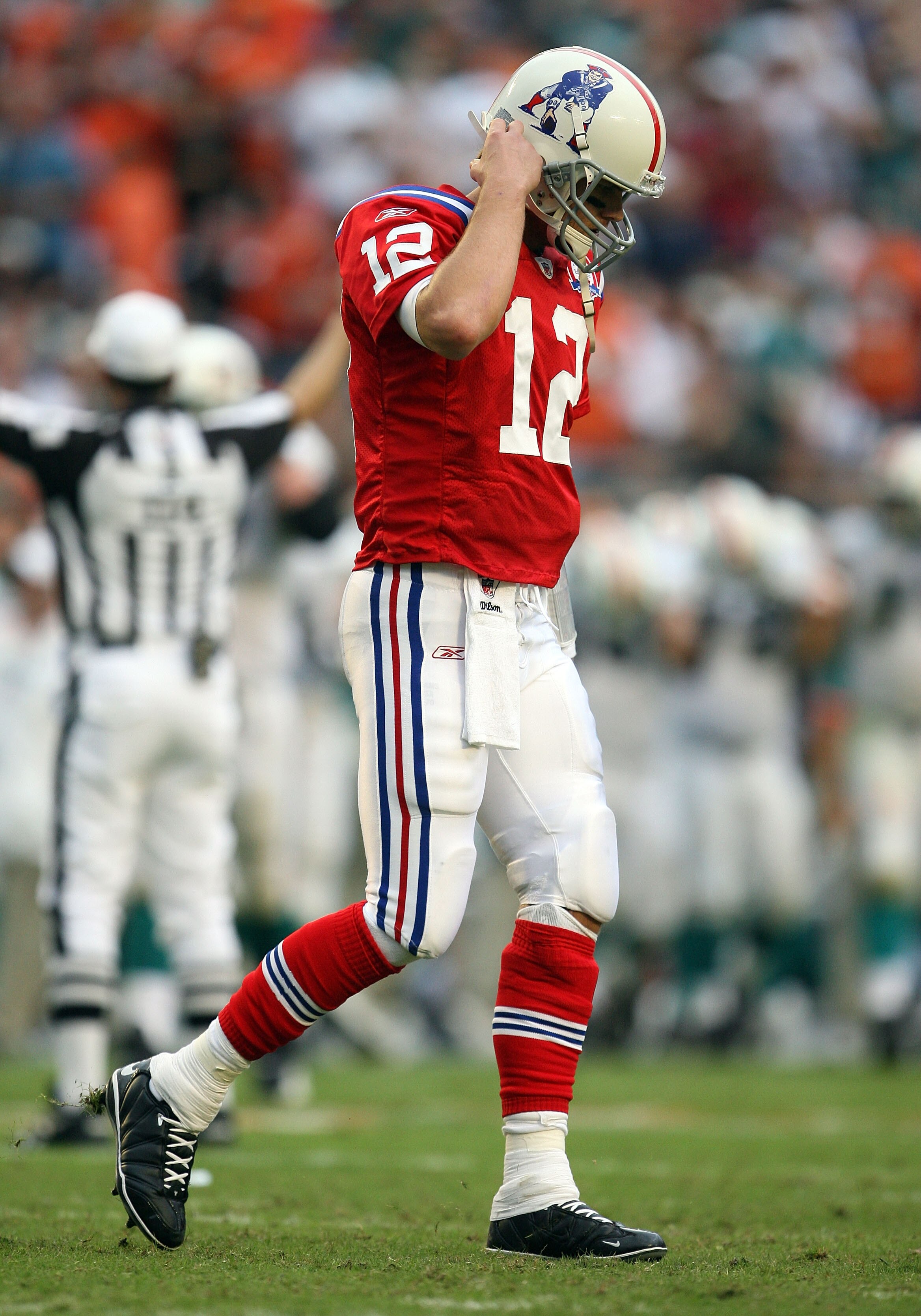 MIAMI - DECEMBER 06:  Quarterback Tom Brady #12 of the New England Patriots reacts after throwing an interception in the end-zone late in the fourth quarter against the Miami Dolphins at Land Shark Stadium on December 6, 2009 in Miami, Florida. The Dolphi
