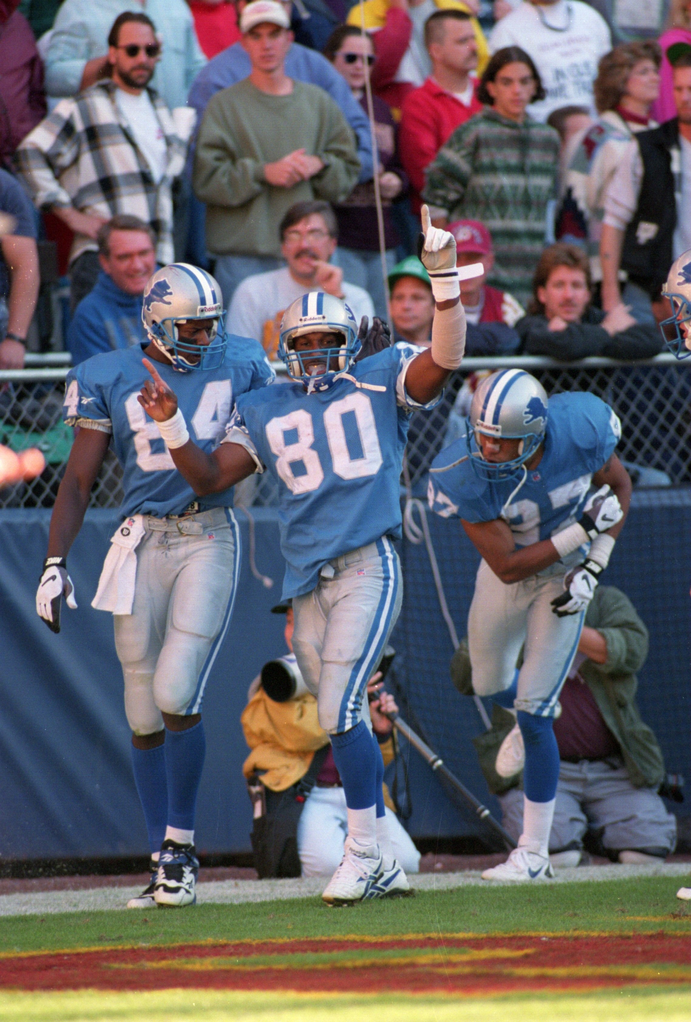 22 OCT 1995:  WIDE RECEIVERS BRETT PERRIMAN #80 HERMAN MOORE #84 AND JOHNNIE MORTON #87 OF THE DETROIT LIONS CELEBRATE A TOUCHDOWN IN THE ENDZONE DURING THE LIONS 36-30 LOSS TO THE WASHINGTON REDSKINS AT RFK STADIUM IN WASHINGTON D.C.  Mandatory Credit: D