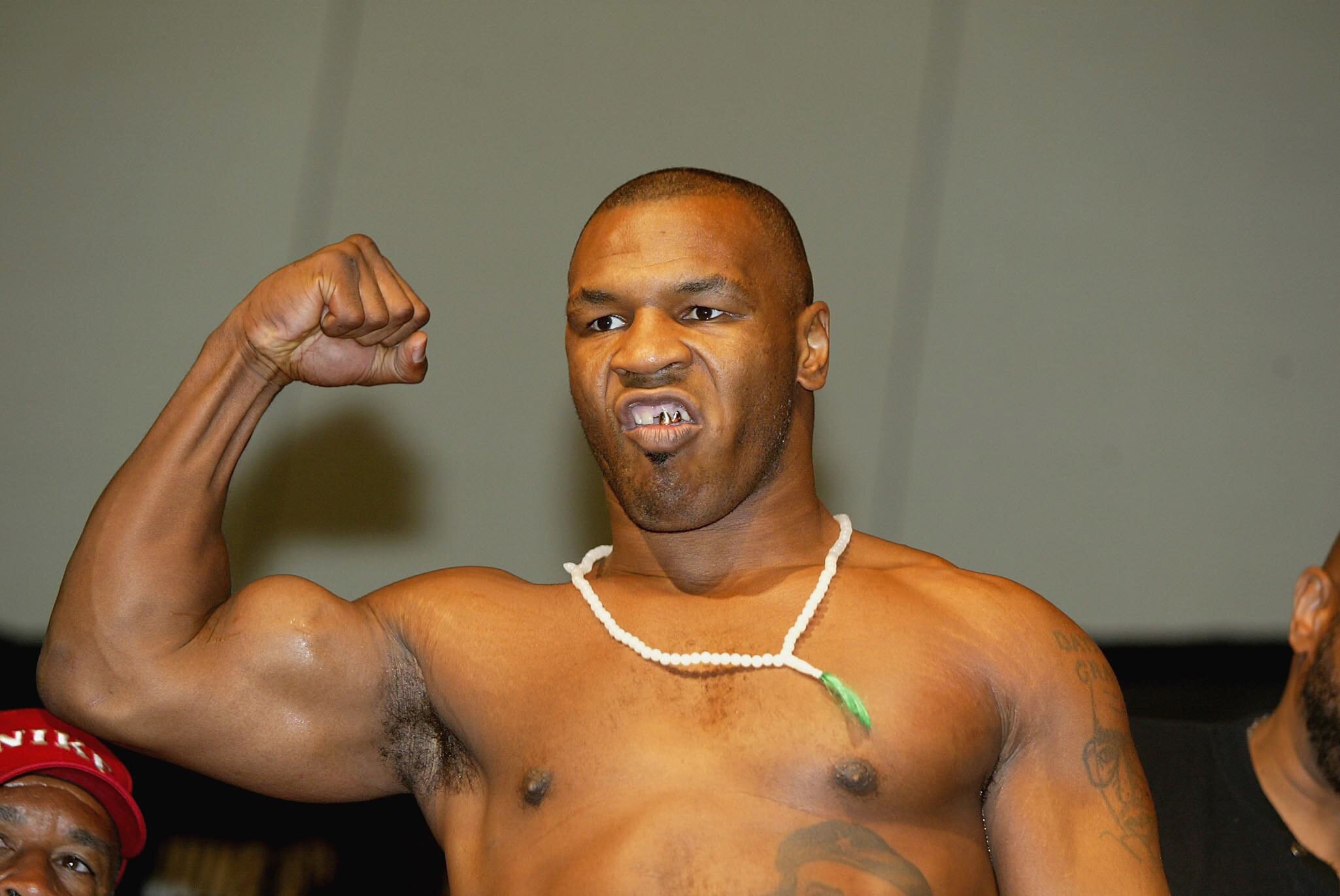 MEMPHIS - JUNE 6:  Mike Tyson of USA weighs-in at the Memphis Convention Centre in Memphis, Tennessee on June 6, 2002.  Tyson is due to fight Lennox Lewis of Great Britain on Saturday 8 June 2002.  (Photo by John Gichigi/Getty Images)