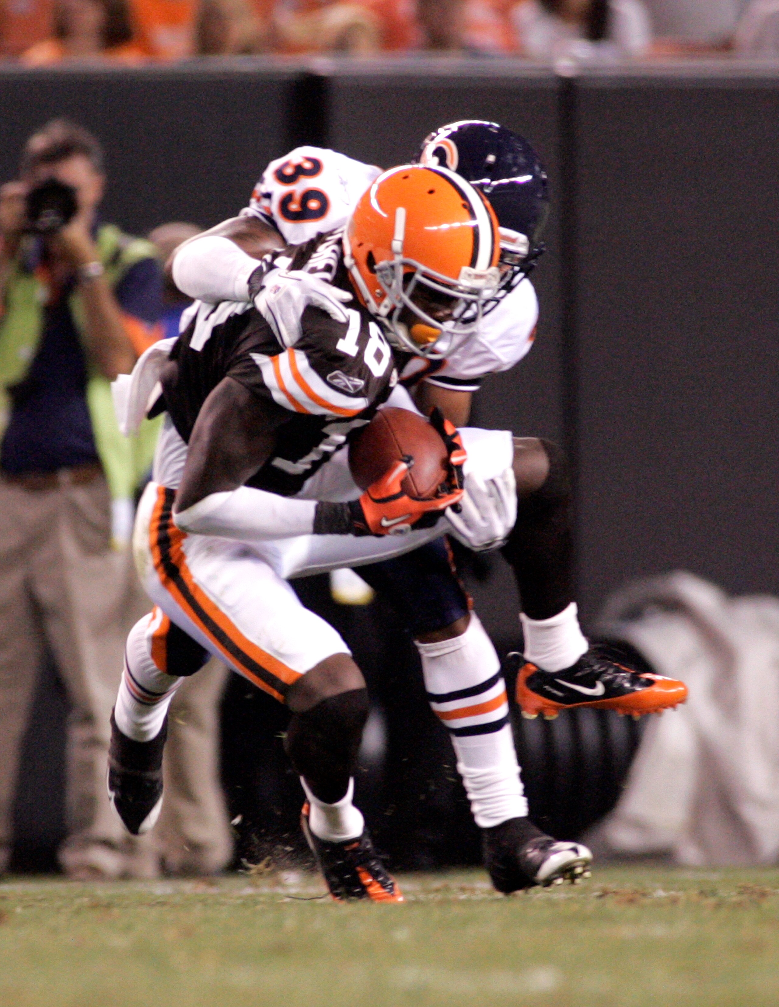 CLEVELAND - SEPTEMBER 2:  Carlton Mitchell #18 of the Cleveland Browns pulls in a catch against Cornelius Brown #39 of the Chicago Bears during the preseason game on September 2, 2010 at Cleveland Browns Stadium in Cleveland, Ohio. The Browns defeated the