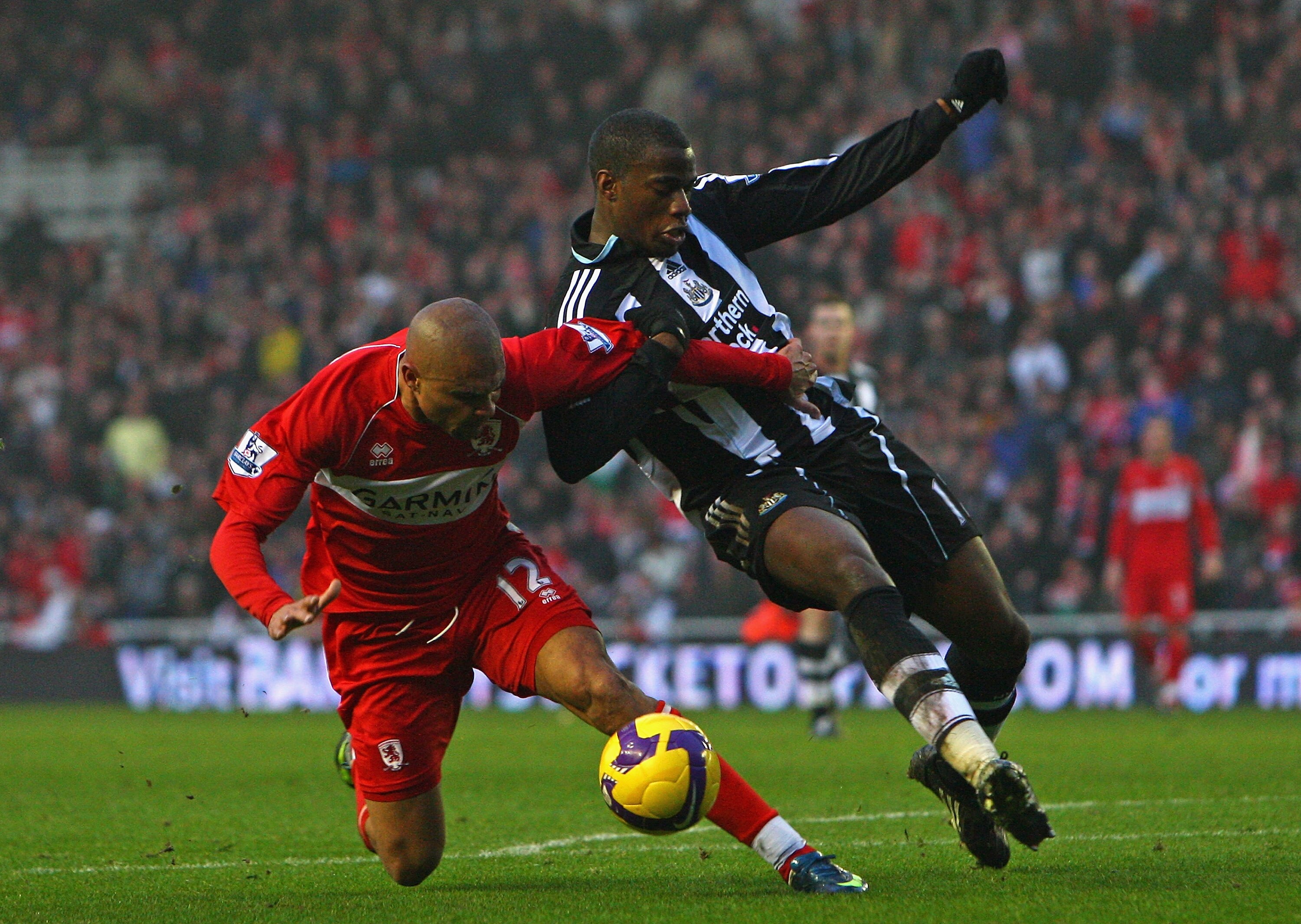 MIDDLESBROUGH, UNITED KINGDOM - NOVEMBER 29:  Sebastien Bassong of Newcastle United tangles in the penalty area with Afonso Alves of Middlesbrough during the Barclays Premier League match between Middlesbrough and Newcastle United at the Riverside Stadium