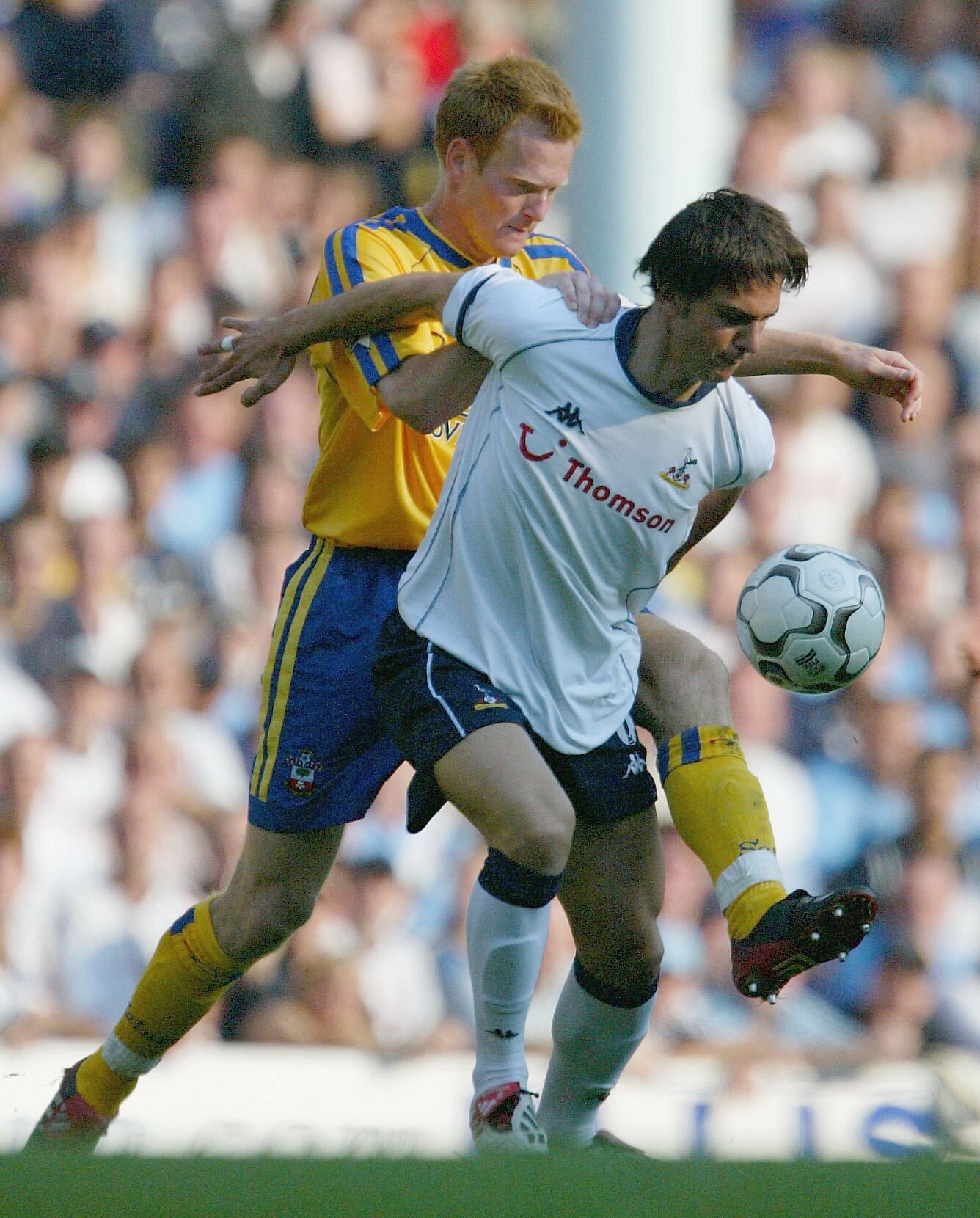 LONDON - SEPTEMBER 20:  Michael Svenson of Southampton tries to tackle Helder Postiga of Tottenham Hotspur during the FA Barclaycard Premiership match between Tottenham Hotspur and Southampton at White Hart Lane on Septenber 20, 2003 in London. (Photo by