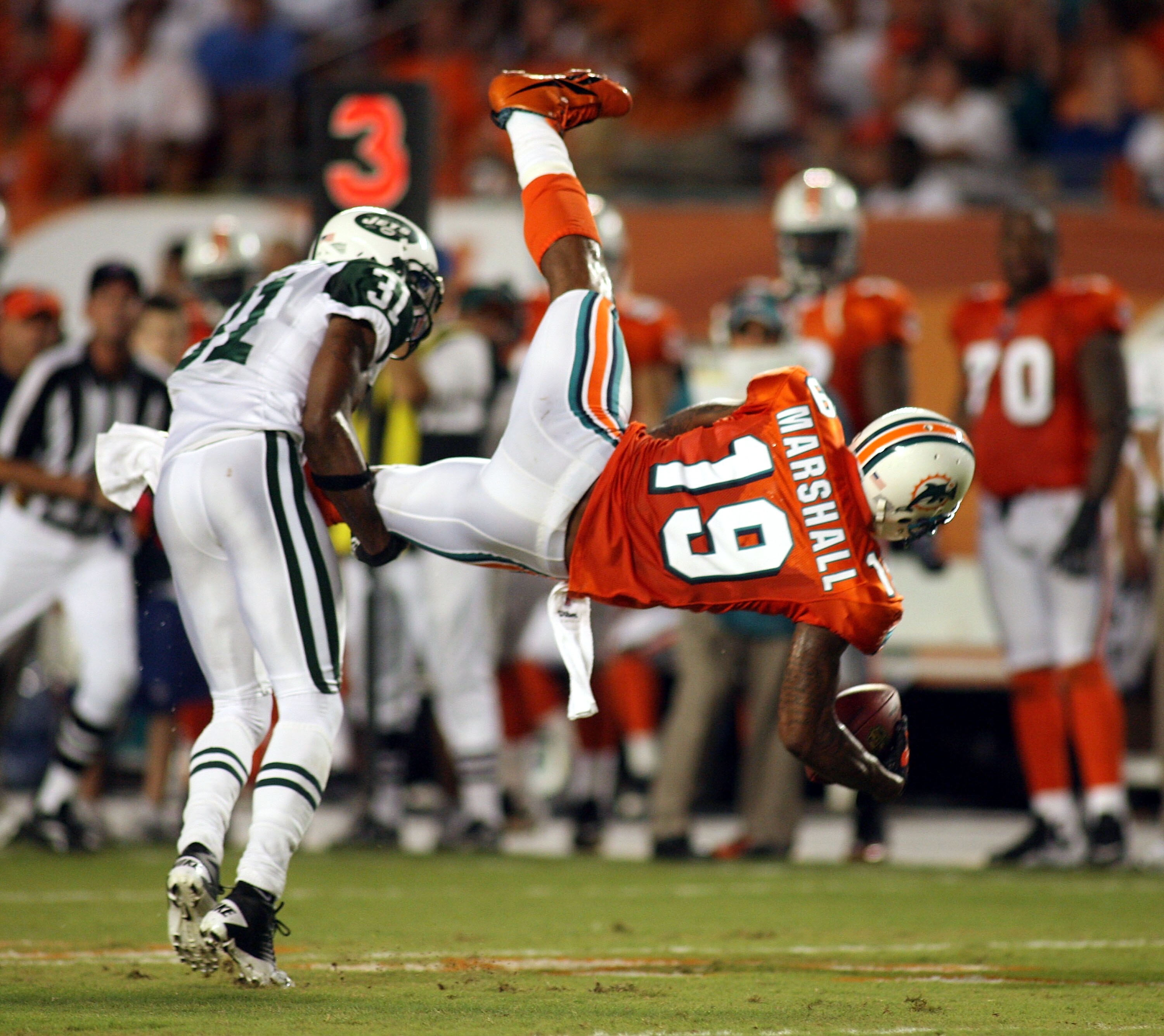 MIAMI - SEPTEMBER 26: Receiver Brandon Marshall #19 of the Miami Dolphins makes a catch against the New York Jets at Sun Life Stadium on September 26, 2010 in Miami, Florida. (Photo by Marc Serota/Getty Images)