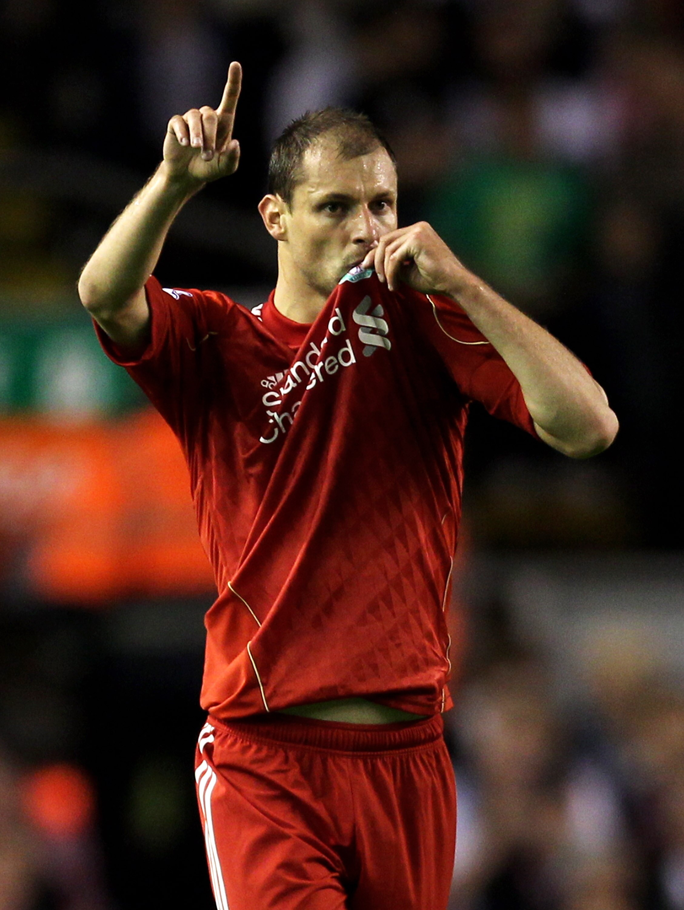 LIVERPOOL, ENGLAND - SEPTEMBER 22:  Milan Jovanovic of Liverpool celebrates scoring the opening goal towards the Kop during the Carling Cup Third Round game between Liverpool and Northampton Town at Anfield on September 22, 2010 in Liverpool, England. (Ph