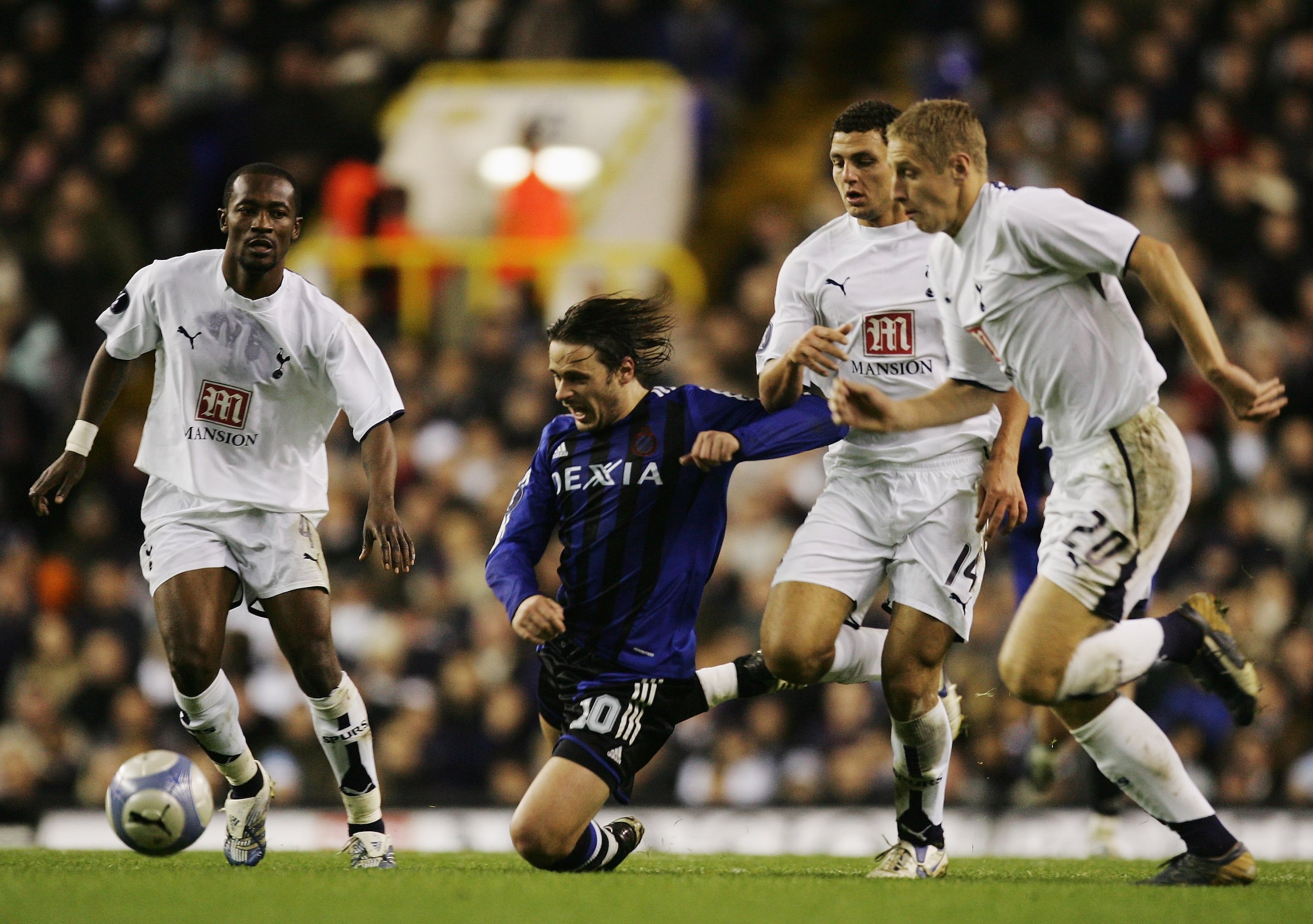 LONDON - NOVEMBER 02:  Bosko Balaban (2nd left) of Club Brugge tries to break thru the Tottenham Hotspur defence of (L-R) Didier Zokora, Hossam Ghaly and Michael Dawson during the UEFA Cup Group B match between Tottenham Hotspur and Club Brugge at White H