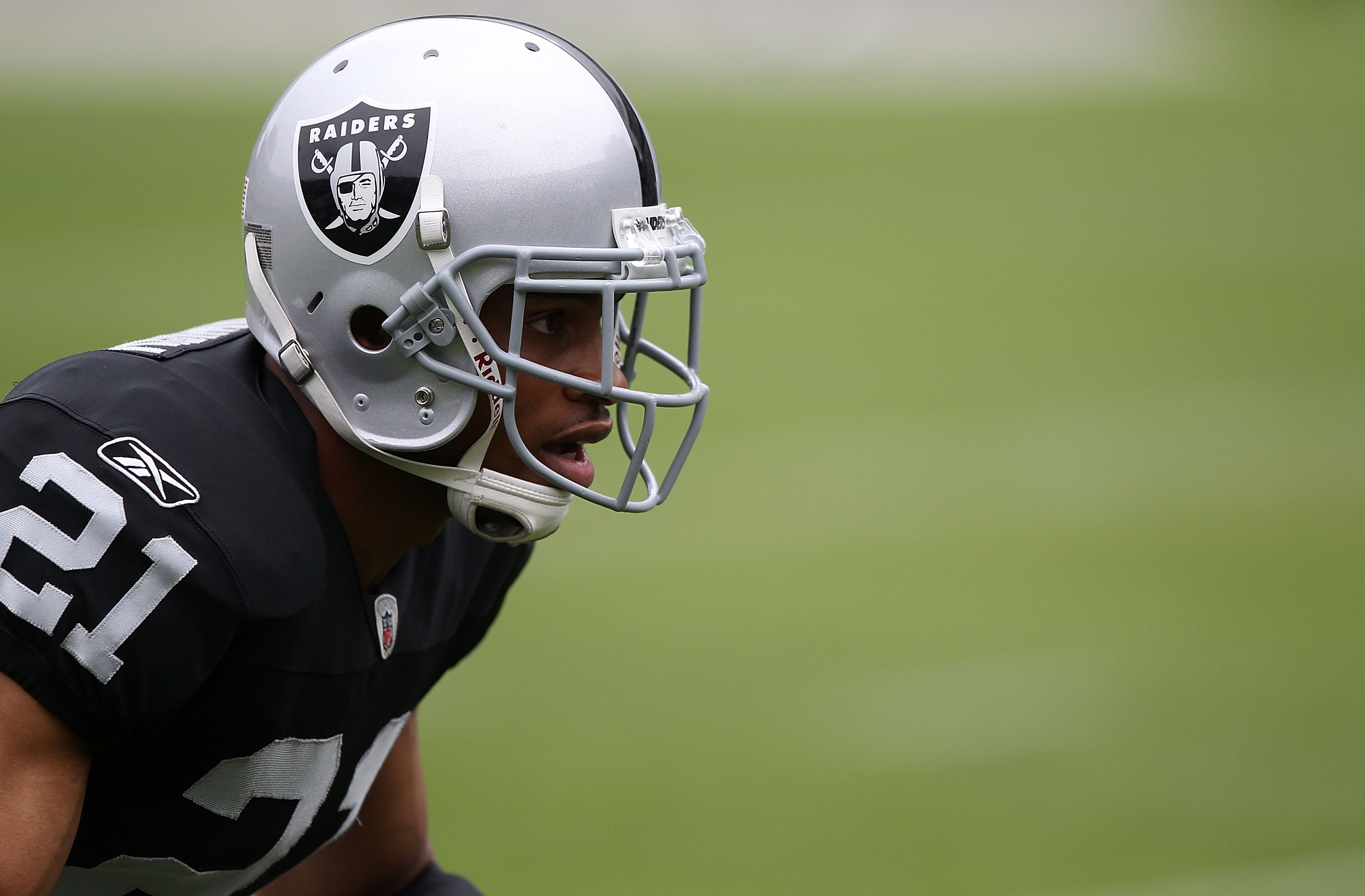 OAKLAND, CA - SEPTEMBER 19:  Nnamdi Asomugha #21 of the Oakland Raiders warms up against the St. Louis Rams during an NFL game at Oakland-Alameda County Coliseum on September 19, 2010 in Oakland, California.  (Photo by Jed Jacobsohn/Getty Images)