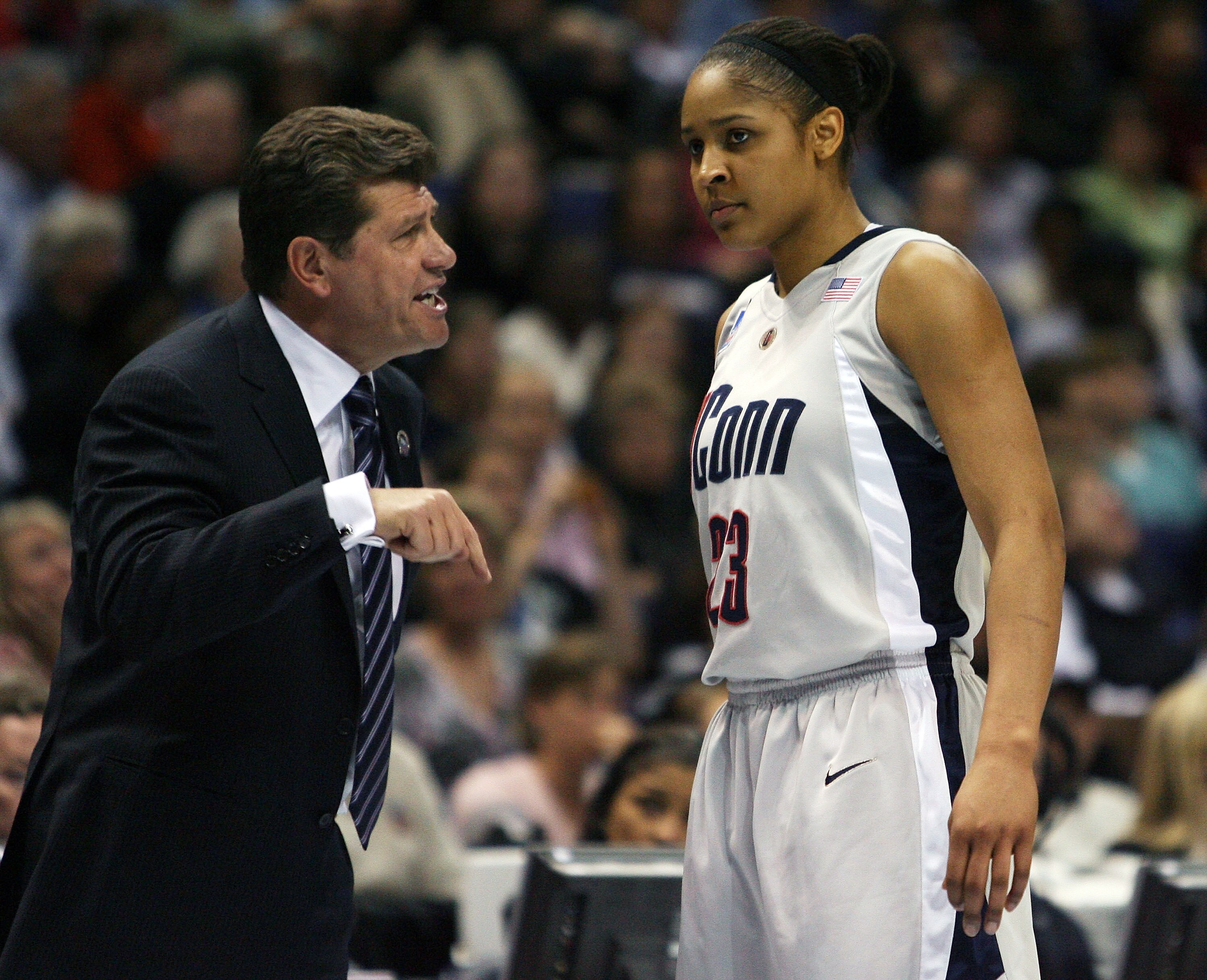 ST. LOUIS - APRIL 07:  Head coach Geno Auriemma of the Connecticut Huskies talks with Maya Moore #23 in the first half against the Louisville Cardinals  on April 7, 2009 during the NCAA Women's Final Four Championship game at the Scottrade Center on April