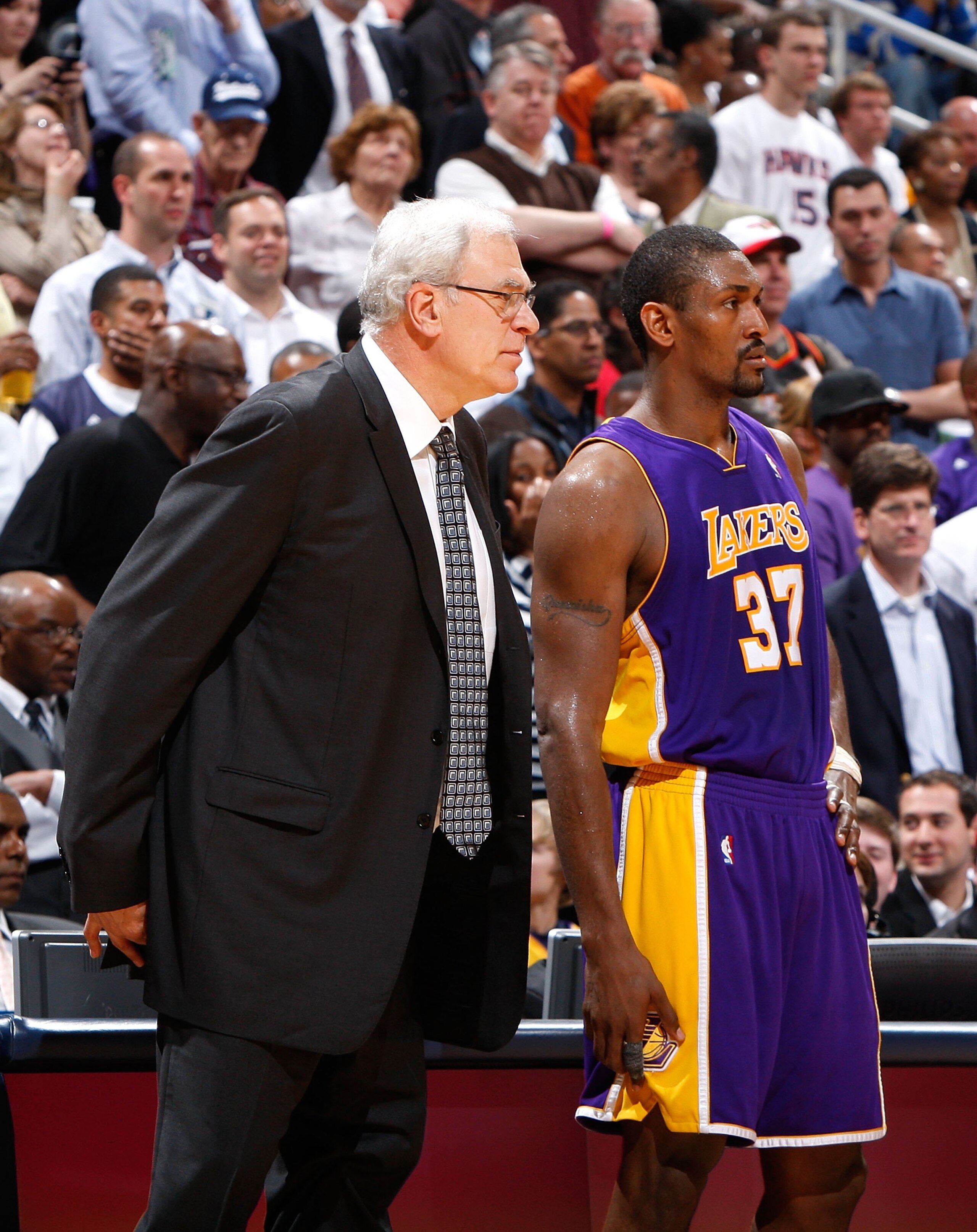 ATLANTA - MARCH 31:  Head coach Phil Jackson and Ron Artest #37 of the Los Angeles Lakers against the Atlanta Hawks at Philips Arena on March 31, 2010 in Atlanta, Georgia.  NOTE TO USER: User expressly acknowledges and agrees that, by downloading and/or u