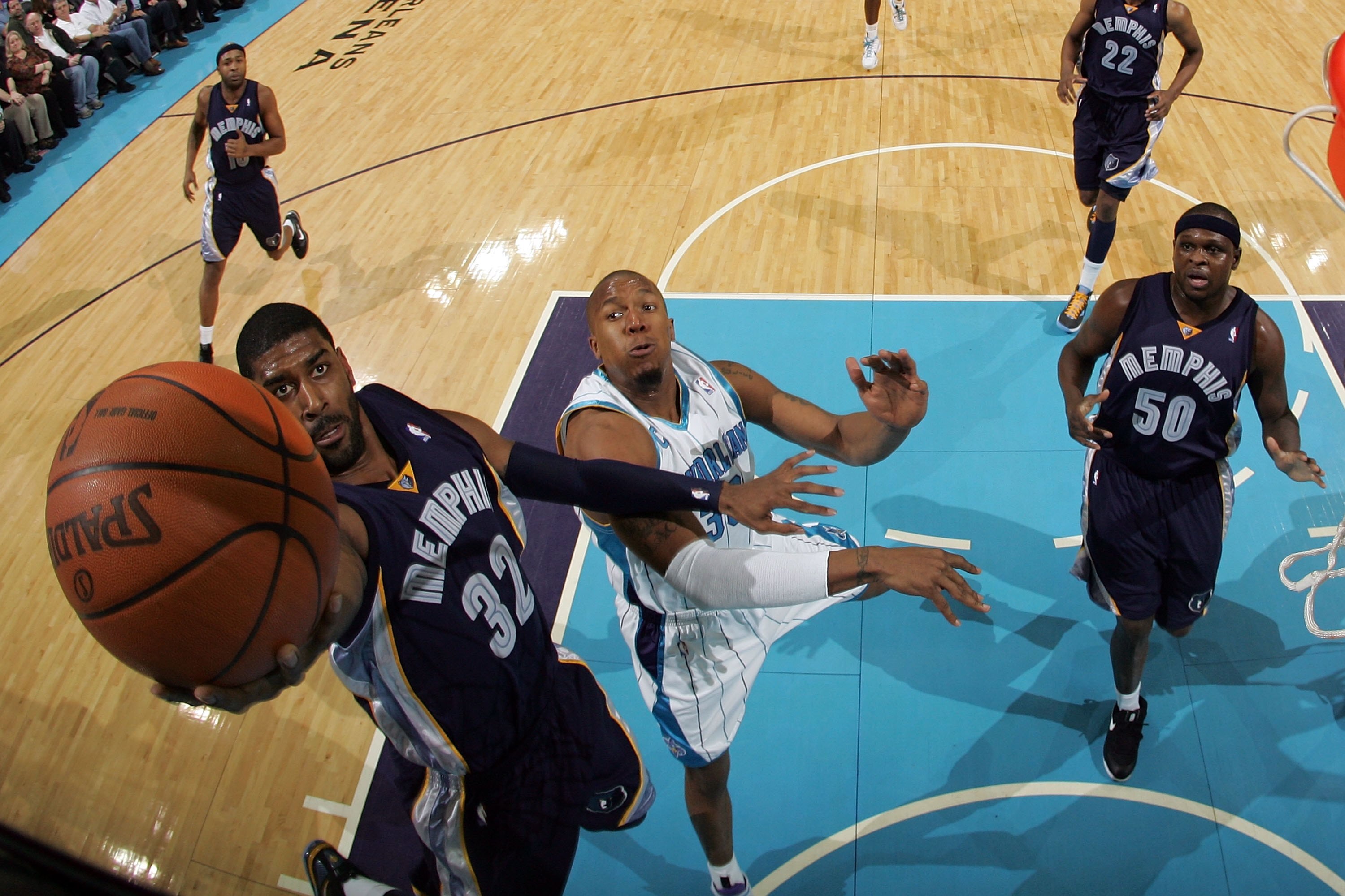 NEW ORLEANS - JANUARY 20:  O.J. Mayo #32 of the Memphis Grizzlies shoots the ball over David West #30 of the New Orleans Hornets at the New Orleans Arena on January 20, 2010 in New Orleans, Louisiana.  NOTE TO USER: User expressly acknowledges and agrees