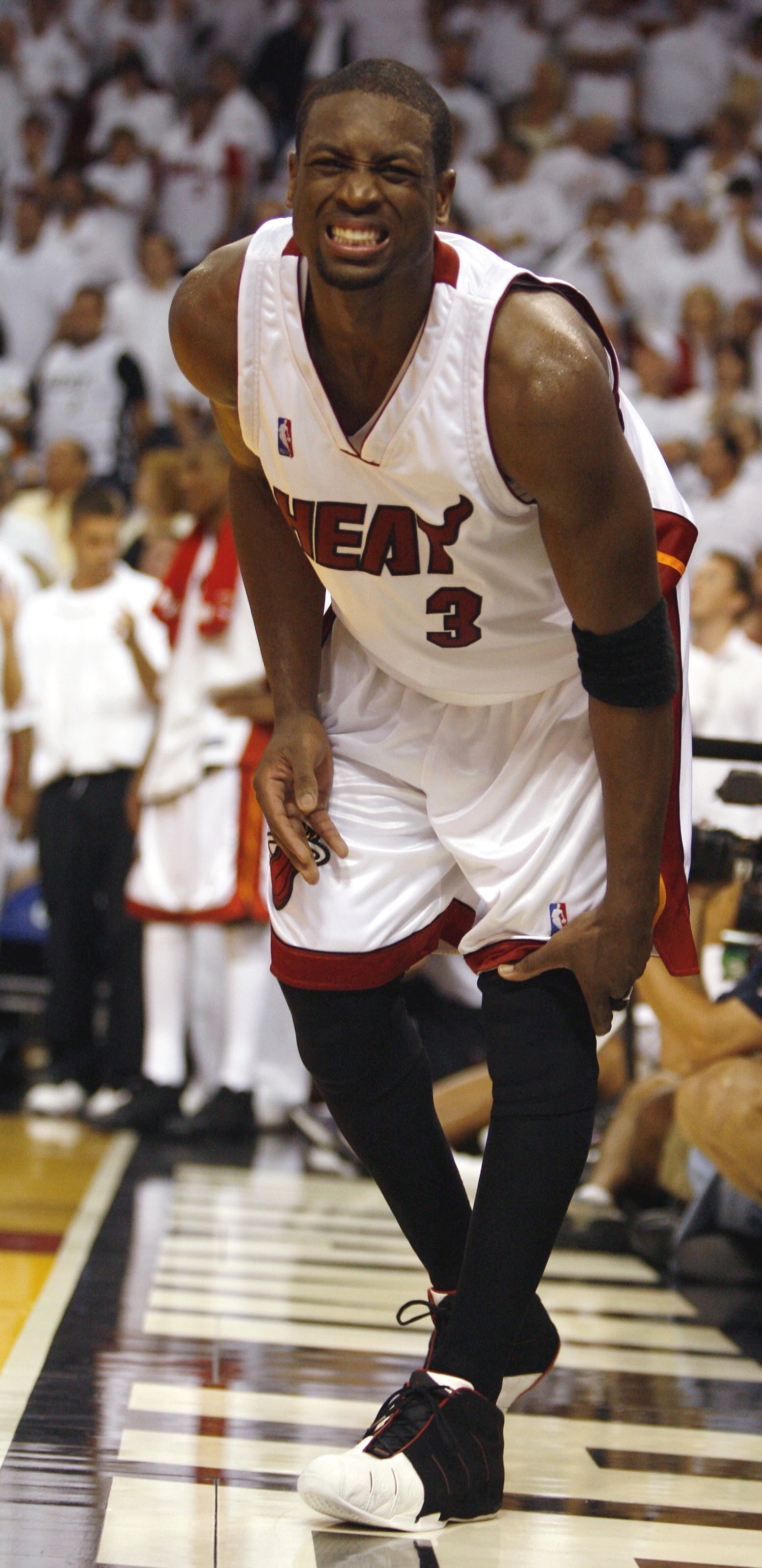 MIAMI - APRIL 22:  Guard Dwyane Wade #3 of the Miami Heat cringes in pain during the fourth quarter against the Chicago Bulls in game one of the Eastern Conference Quarterfinals during the 2006 NBA Playoffs on April 22, 2006 at the American Airlines Arena