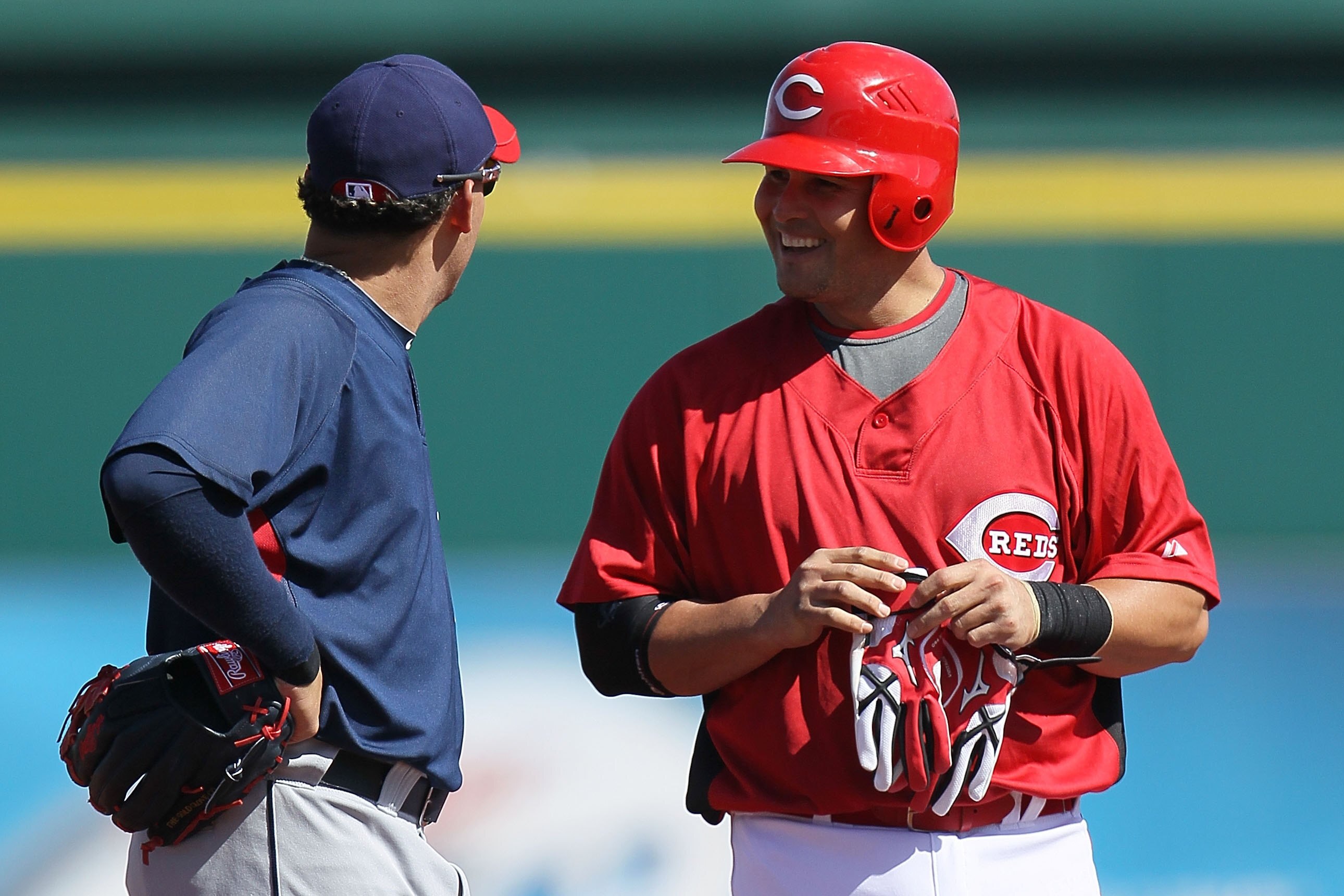 GOODYEAR, AZ - MARCH 05: Asdrubal Cabrera #13 of the Cleveland Indians talks with Ramon Hernandez #55 of the Cincinnati Reds during a spring training game at Goodyear Ballpark on March 5, 2010 in Goodyear, Arizona.  (Photo by Chris McGrath/Getty Images)