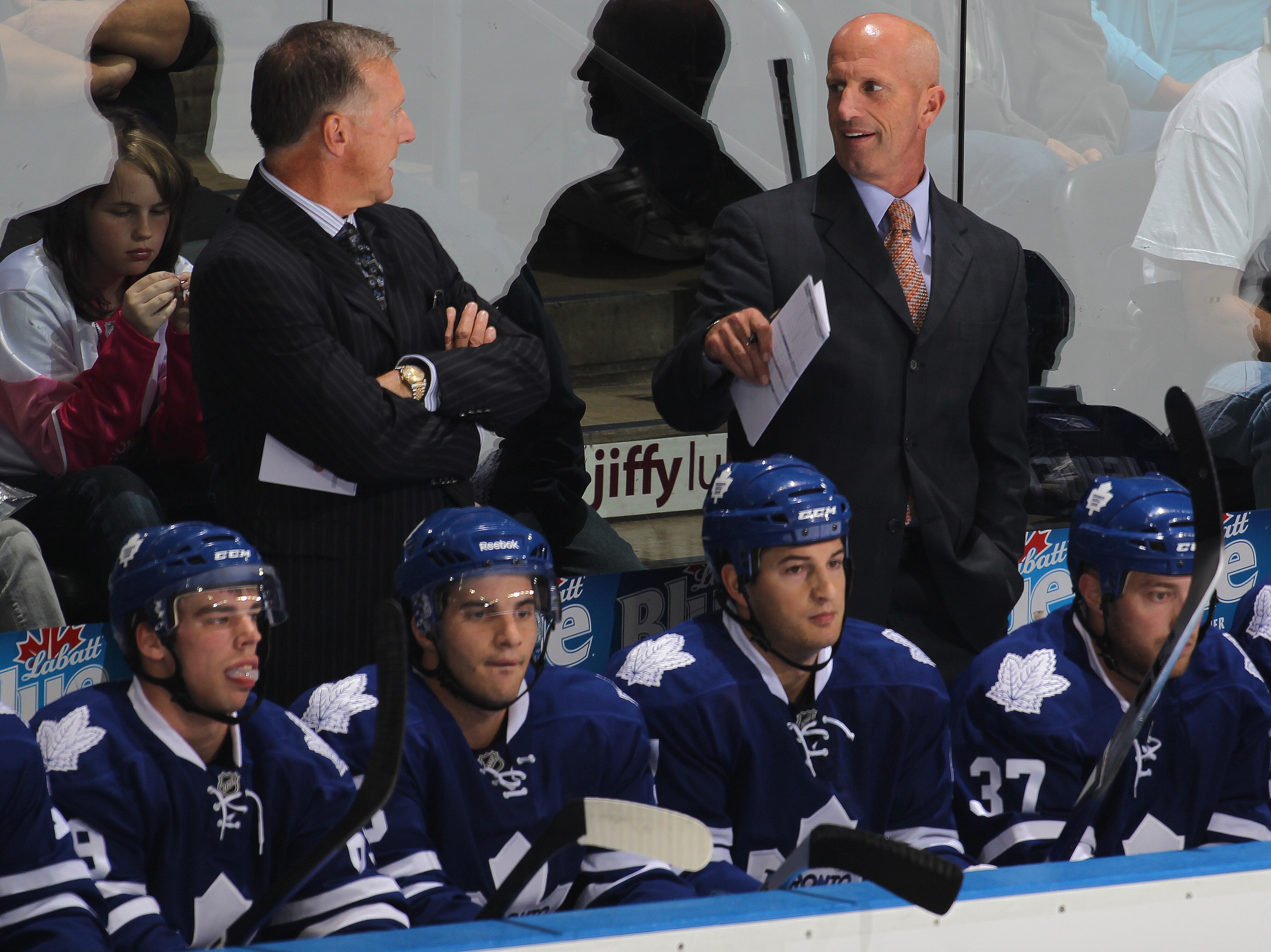 LONDON,ON - SEPTEMBER 23: Head Coach Ron Wilson and assistant Keith Acton of the Toronto Maple Leafs confer in a pre-season game against the Philadelphia Flyers on September 23,2010 at the John Labatt Centre in London, Ontario. The Leafs defeated the Flye