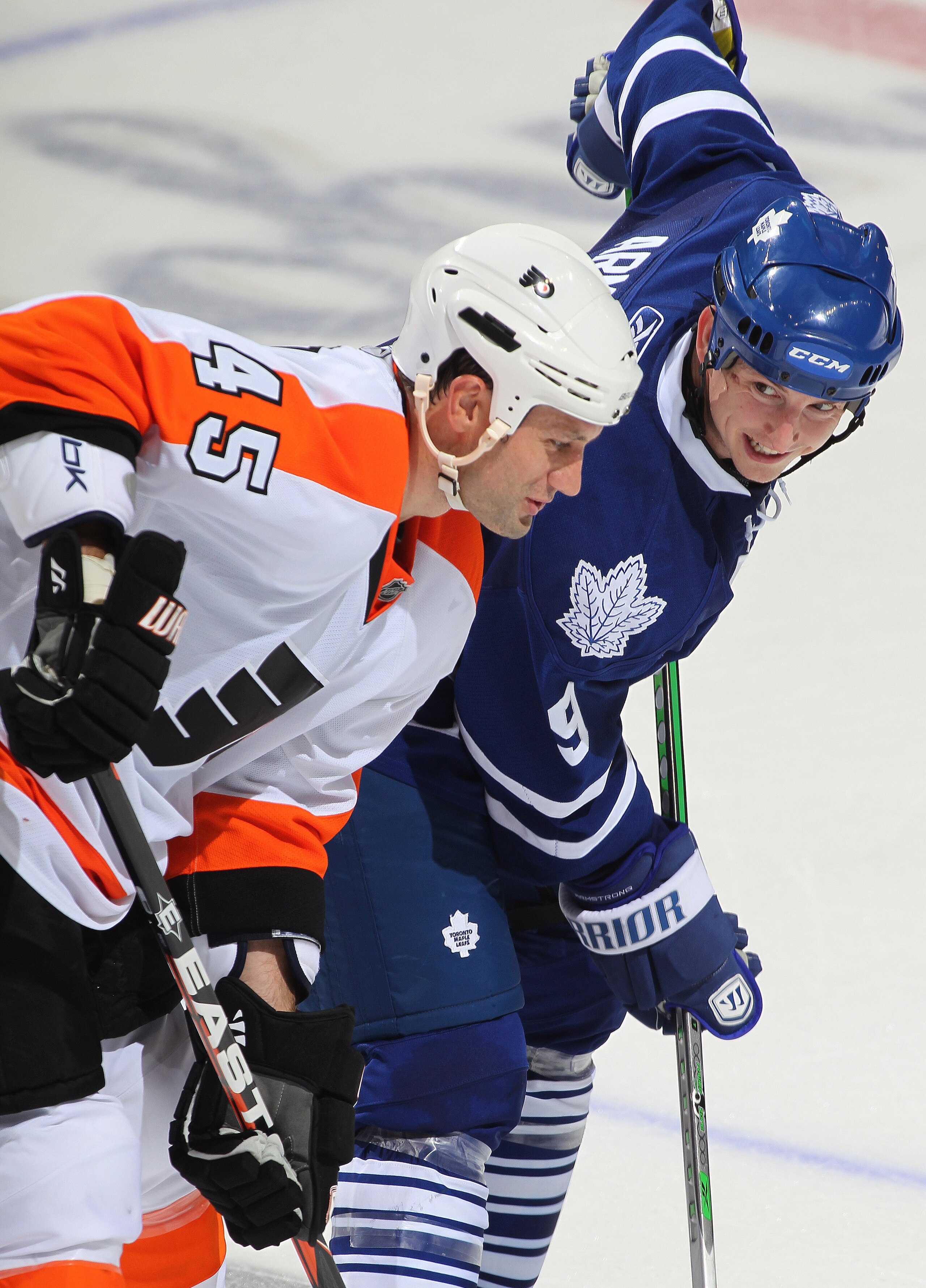 LONDON,ON - SEPTEMBER 23: Colby Armstrong #9 of the Toronto Maple Leafs has something funny to say to Jody Shelley #45 of the Philadelphia Flyers in a pre-season game on September 23,2010 at the John Labatt Centre in London, Ontario. The Leafs defeated th