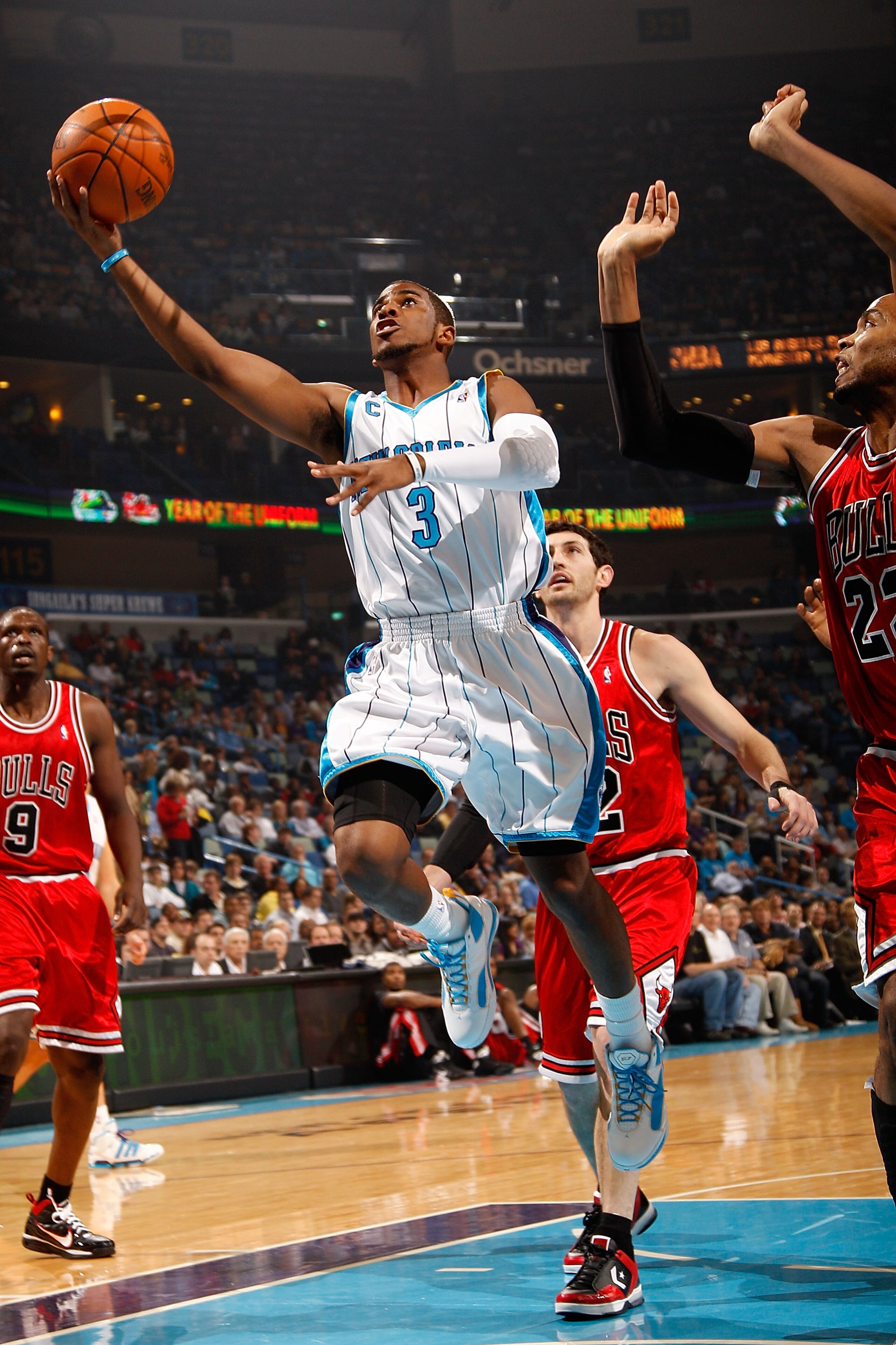 NEW ORLEANS - JANUARY 29:  Chris Paul #3 of the New Orleans Hornets makes a shot over Taj Gibson #22 of the Chicago Bulls at the New Orleans Arena on January 29, 2010 in New Orleans, Louisiana.   NOTE TO USER: User expressly acknowledges and agrees that, 