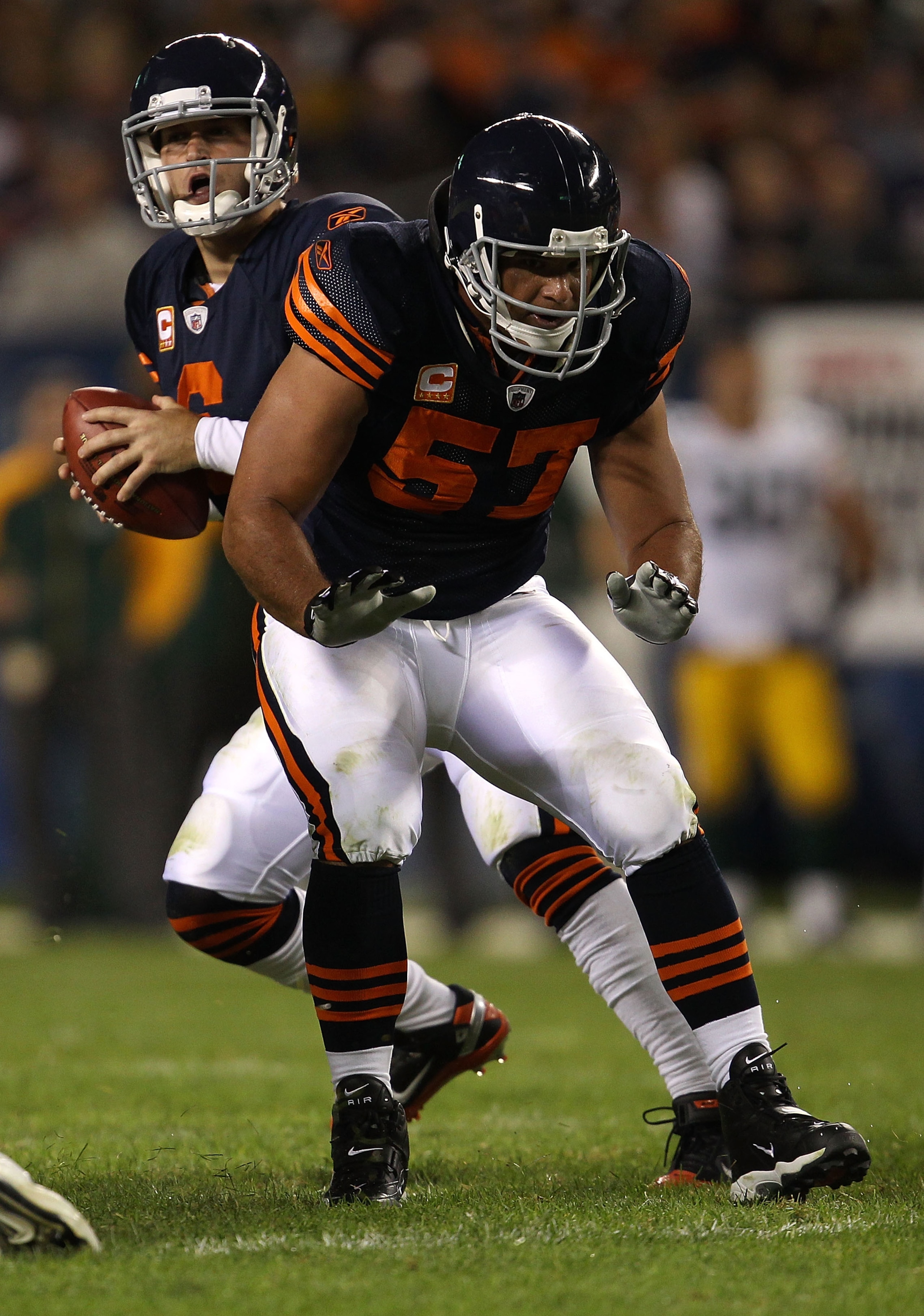 CHICAGO - SEPTEMBER 27:  Center Olin Kreutz #57 of the Chicago Bears blocks for quarterback Jay Cutler #6 against the Green Bay Packers at Soldier Field on September 27, 2010 in Chicago, Illinois. The Bears won 20-17. (Photo by Jonathan Daniel/Getty Image
