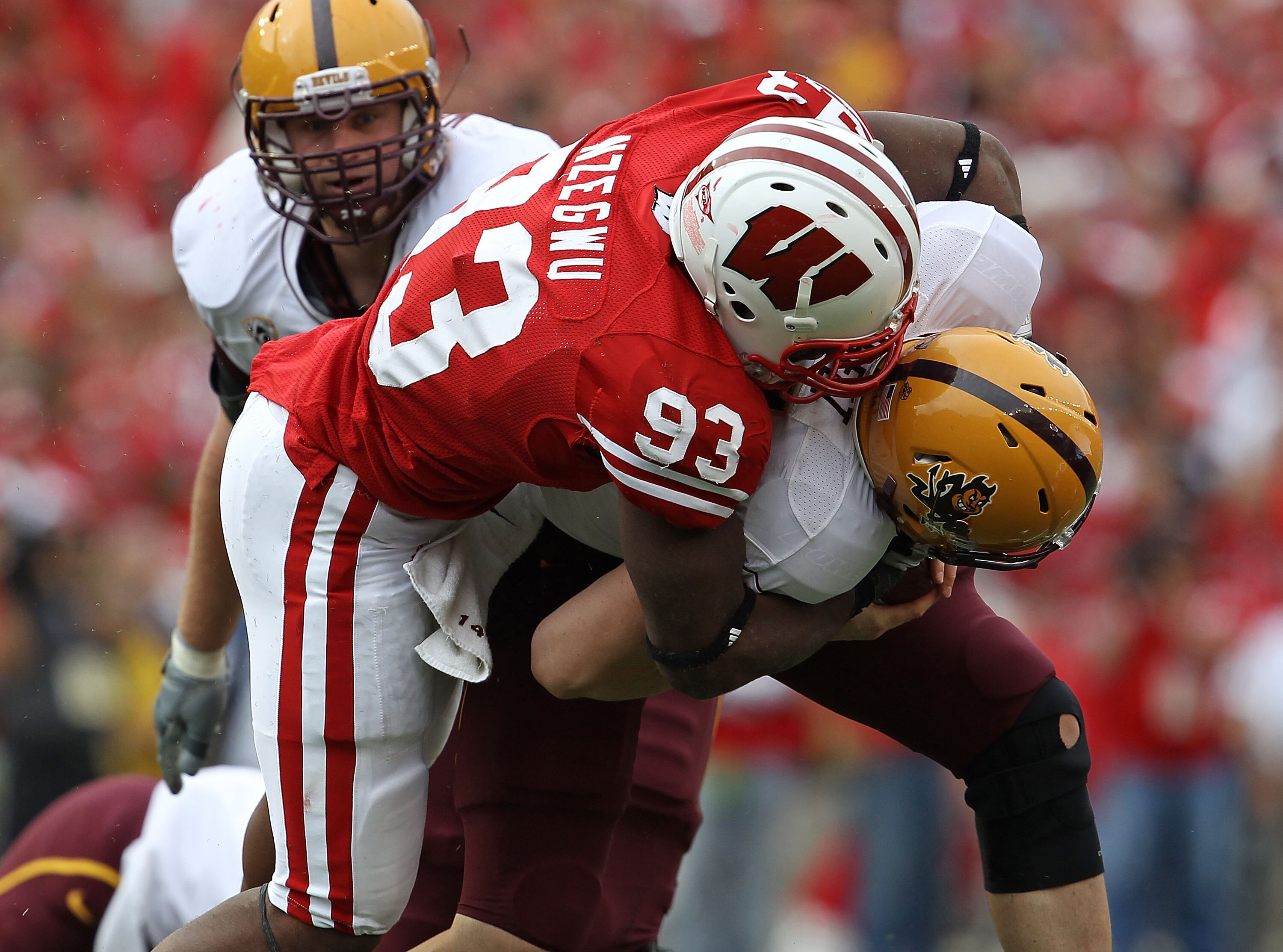MADISON, WI - SEPTEMBER 18: Louis Nzegwu #93 of the Wisconsin Badgers sacks Steven Threet #14 of the Arizona State Sun Devils at Camp Randall Stadium on September 18, 2010 in Madison, Wisconsin.  Wisconsin defeated Arizona State 20-19. (Photo by Jonathan 