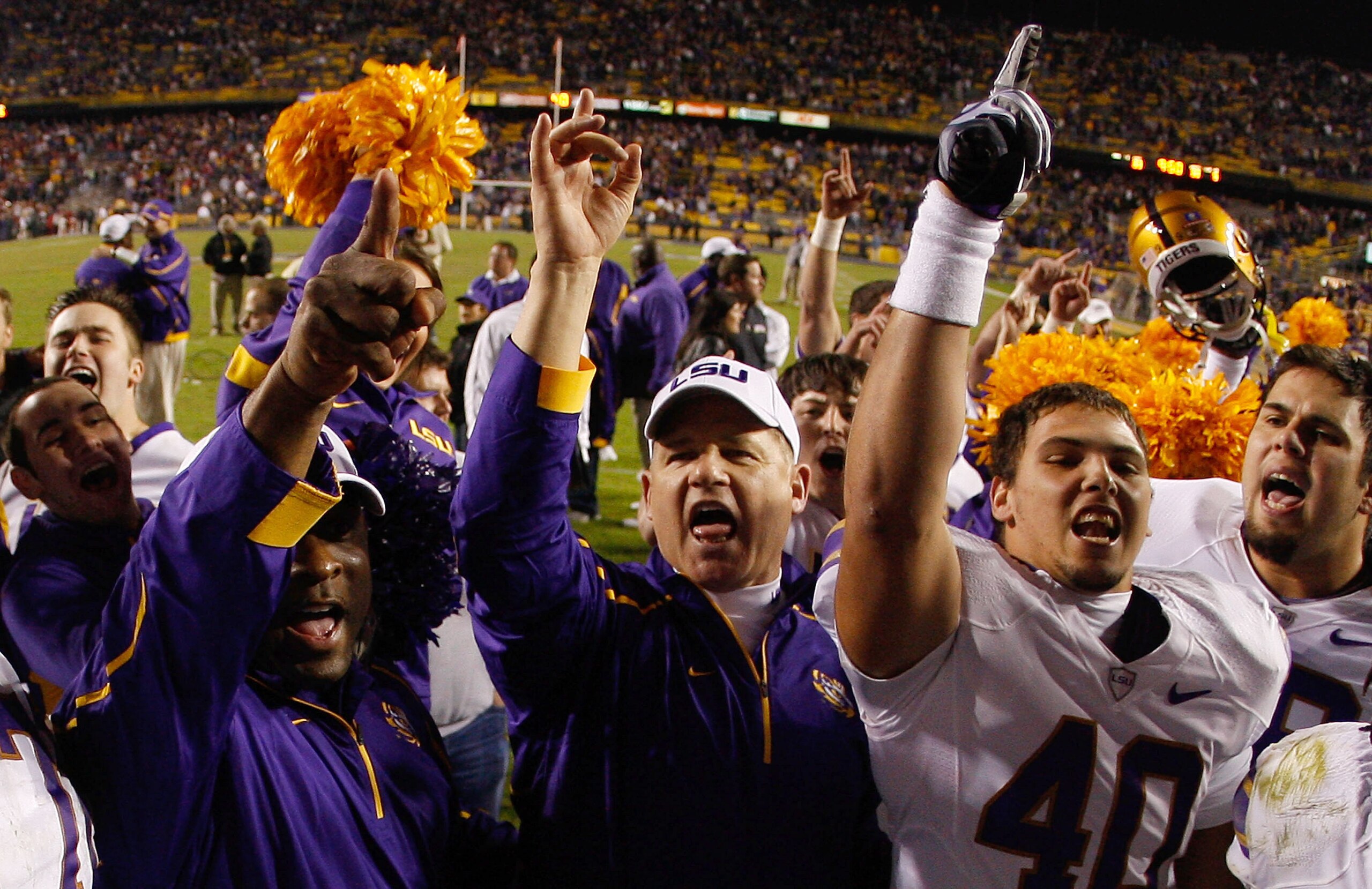 BATON ROUGE, LA - NOVEMBER 28:  Head Coach Les Miles of the LSU Tigers, center, celebrates after defeating the Arkansa Razorbacks 33-30 in overtime at Tiger Stadium on November 28, 2009 in Baton Rouge, Louisiana.  (Photo by Chris Graythen/Getty Images)