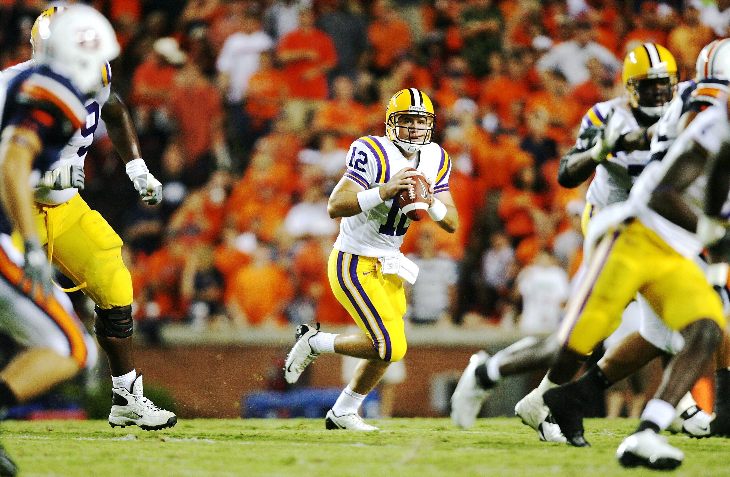 AUBURN, AL - SEPTEMBER 20:  Quarterback Jarrett Lee #12 of the LSU Tigers rolls out to pass against the Auburn Tigers at Jordan-Hare Stadium on September 20, 2008 in Auburn, Alabama. LSU defeated Auburn 26-21.  (Photo by Doug Benc/Getty Images)