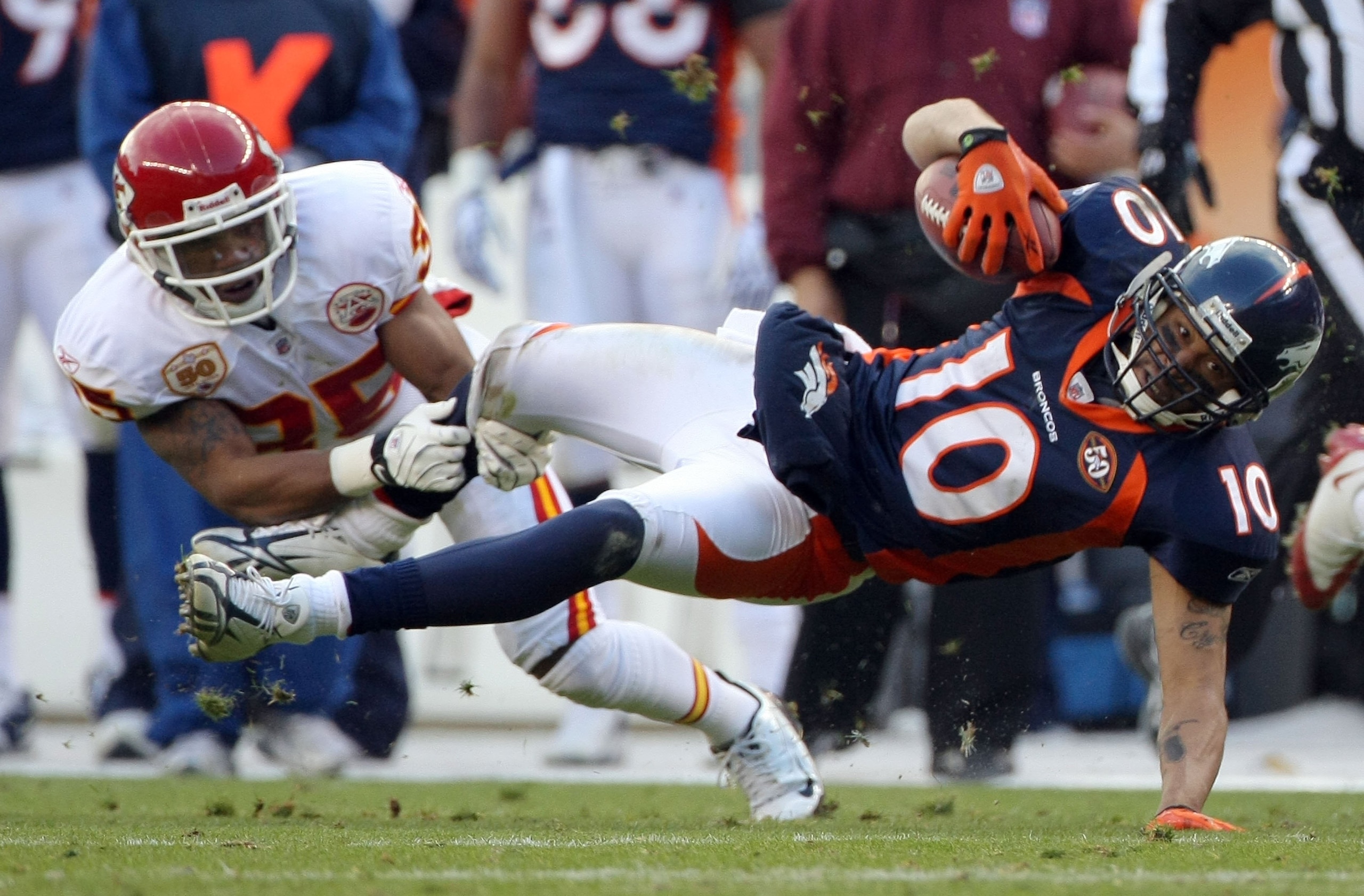 DENVER - JANUARY 03:  Wide receiver Jabar Gaffney #10 of the Denver Broncos makes a first down reception as Ricky Price #35 of the Kansas City Chiefs makes the tackle during NFL action at Invesco Field at Mile High on January 3, 2010 in Denver, Colorado. 