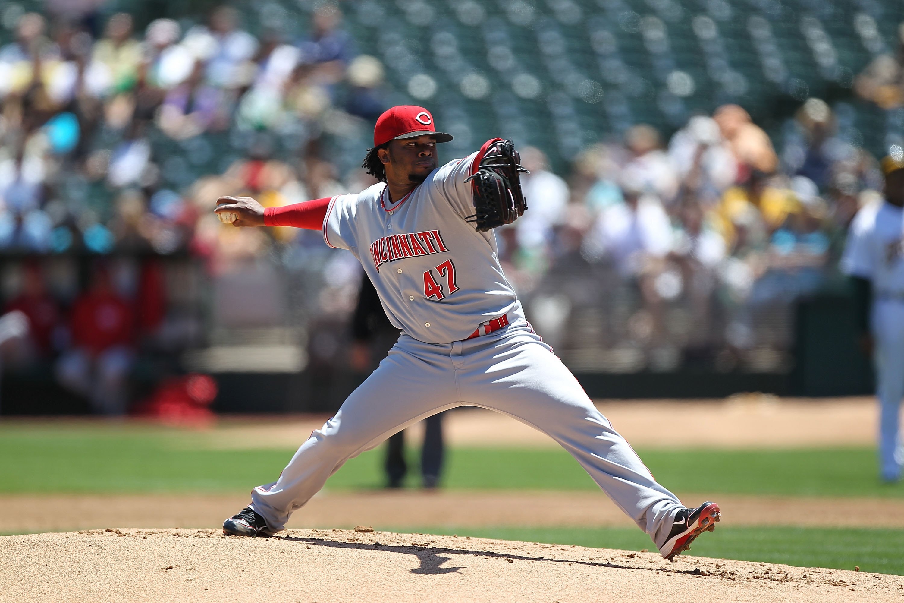 OAKLAND, CA - JUNE 23:  Johnny Cueto #47 of the Cincinnati Reds pitches against the Oakland Athletics during an MLB game at the Oakland-Alameda County Coliseum on June 23, 2010 in Oakland, California.  (Photo by Jed Jacobsohn/Getty Images)