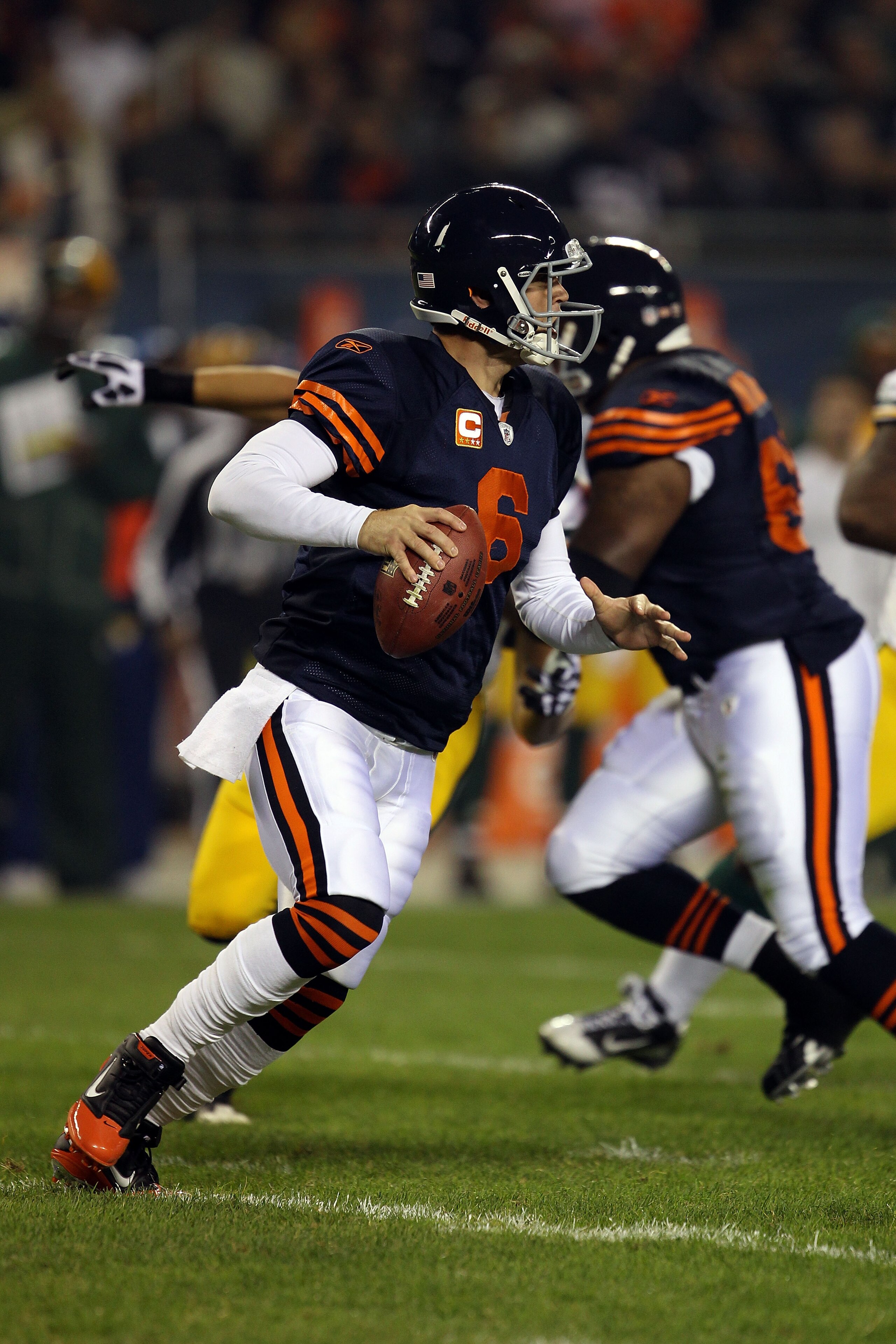 CHICAGO - SEPTEMBER 27:  Jay Cutler #6 of the Chicago Bears rolls out to pass against the Green Bay Packers at Soldier Field on September 27, 2010 in Chicago, Illinois. The Bears won 20-17.  (Photo by Jonathan Daniel/Getty Images)