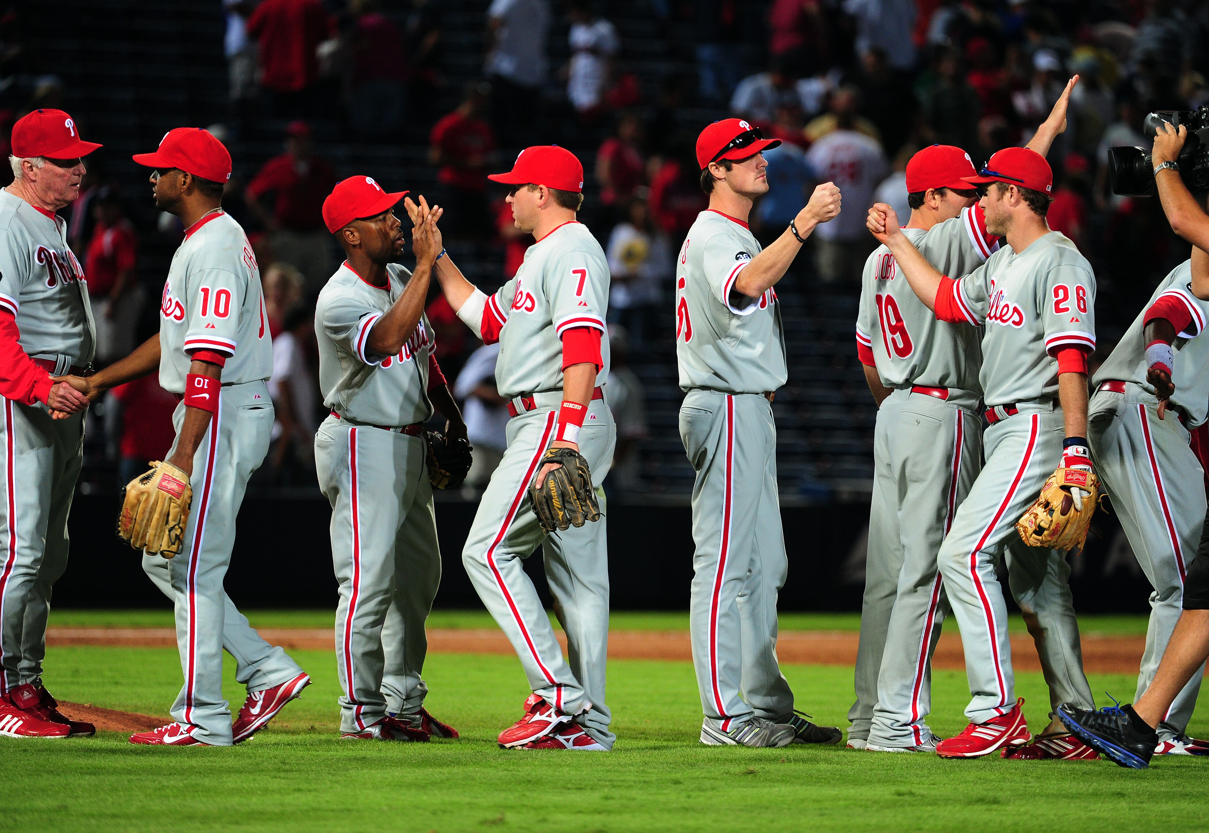 ATLANTA - OCTOBER 2: Members of the Philadelphia Phillies celebrate after the game against the Atlanta Braves at Turner Field on October 2, 2010 in Atlanta, Georgia.  (Photo by Scott Cunningham/Getty Images)