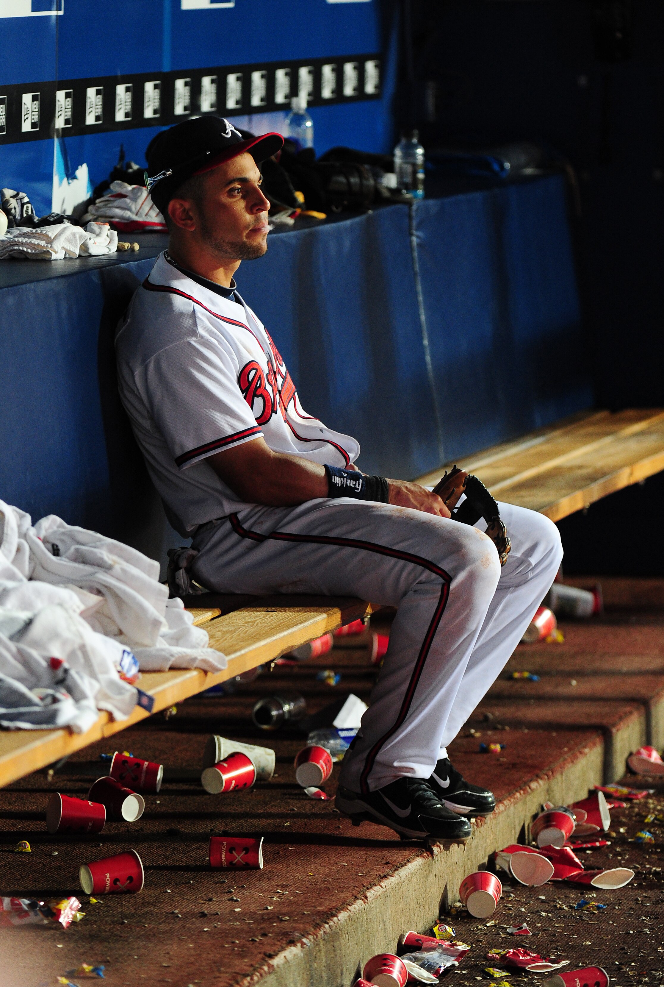 ATLANTA - OCTOBER 2: Omar Infante #4 the Atlanta Braves sits in the dugout after the game against the Philadelphia Phillies at Turner Field on October 2, 2010 in Atlanta, Georgia.  (Photo by Scott Cunningham/Getty Images)