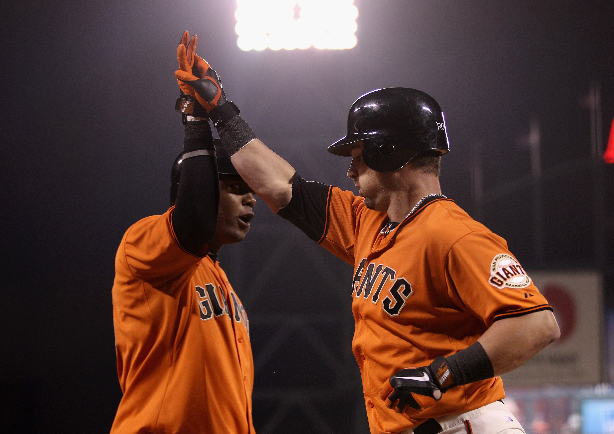 SAN FRANCISCO - OCTOBER 01:  Aaron Rowand #33 of the San Francisco Giants is congratulated by Edgar Renteria #16 after Rowand hit a two run home run in the sixth inning of their game against the San Diego Padres at AT&T Park on October 1, 2010 in San Fran