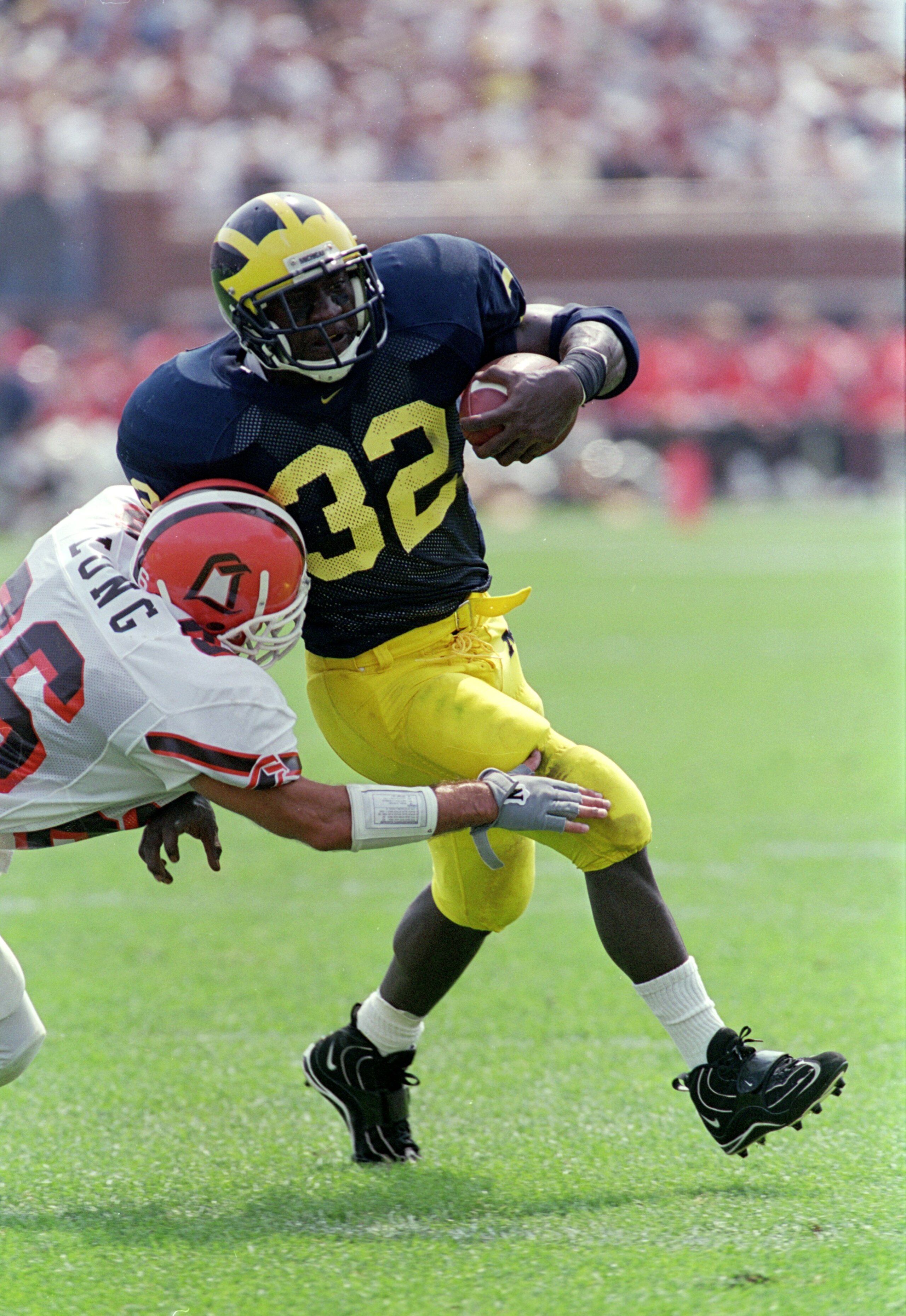 2 Sep 2000: Anthony Thomas #32 of the Michigan Wolverines avoids getting tackled during the game against the Bowling Green Falcons at Michigan Stadium in Ann Arbor, Michigan. The Wolverines defeated the Falcons 42-7.Mandatory Credit: Danny Moloshok  /Alls