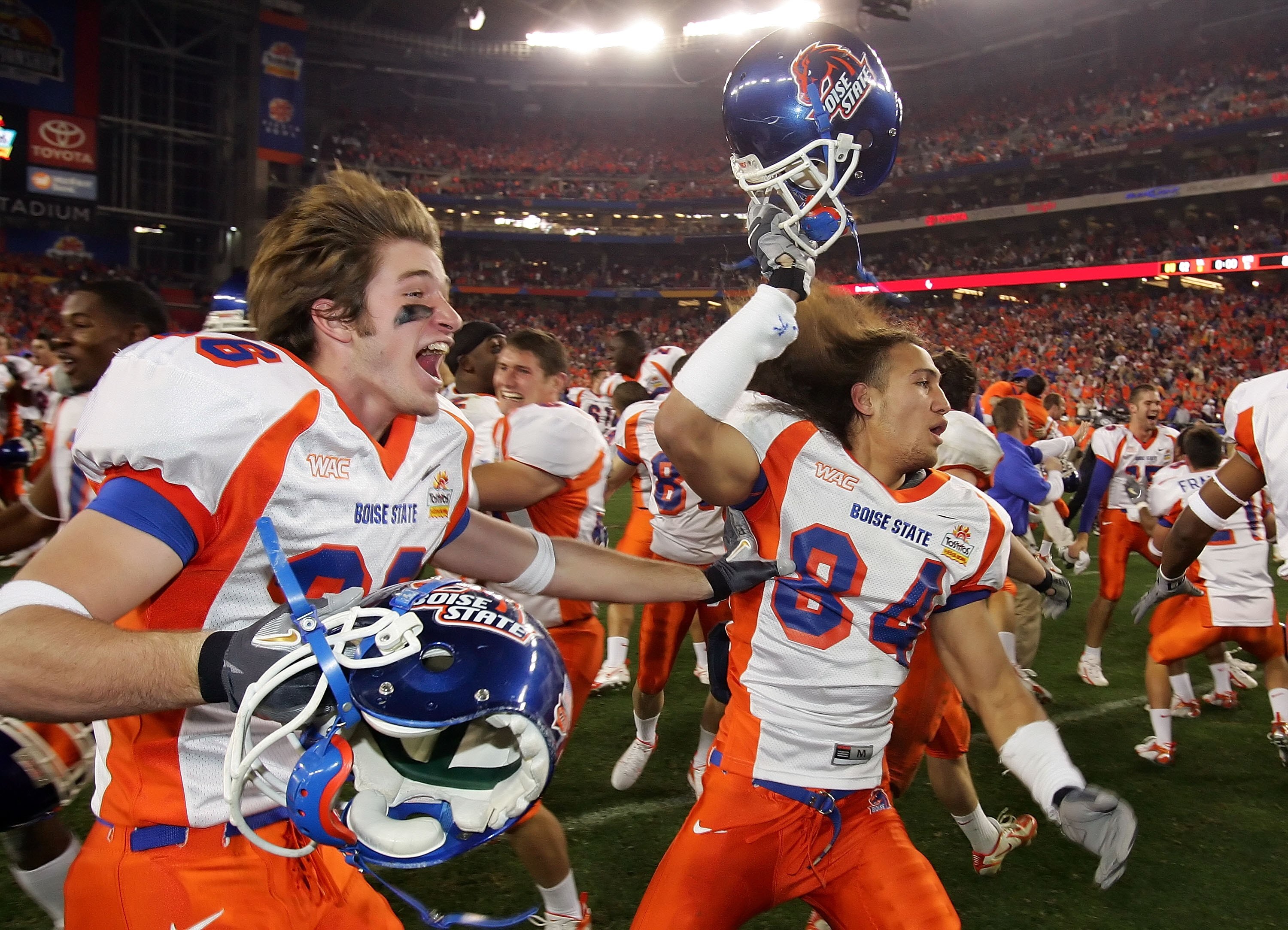 GLENDALE, AZ - JANUARY 01:  Seth Anderson (L) #36 and Aiona Key #84 of the Boise State Broncos celerbate a win over the Oklahoma Sooners 43-42 at the Tostito's Fiesta Bowl at University of Phoenix Stadium January 1, 2007 in Glendale, Arizona.  (Photo by J