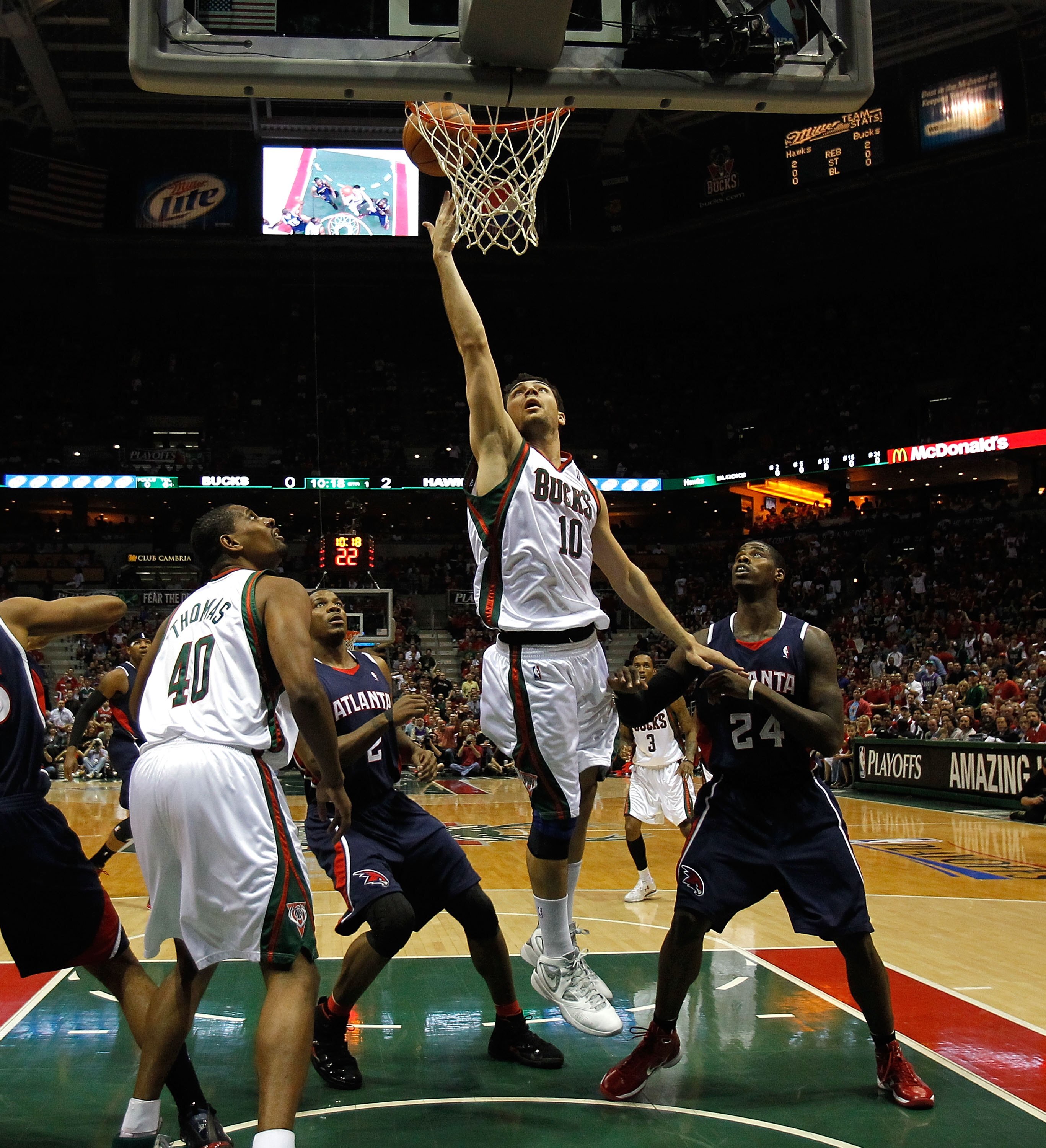 MILWAUKEE - APRIL 30: Carlos Delfino #10 of the Milwaukee Bucks puts up a shot over teammate Kurt Thomas #40 and Joe Johnson #2 and Marvin Williams #24 of the Atlanta Hawks in Game Six of the Eastern Conference Quarterfinals during the 2010 NBA Playoffs a