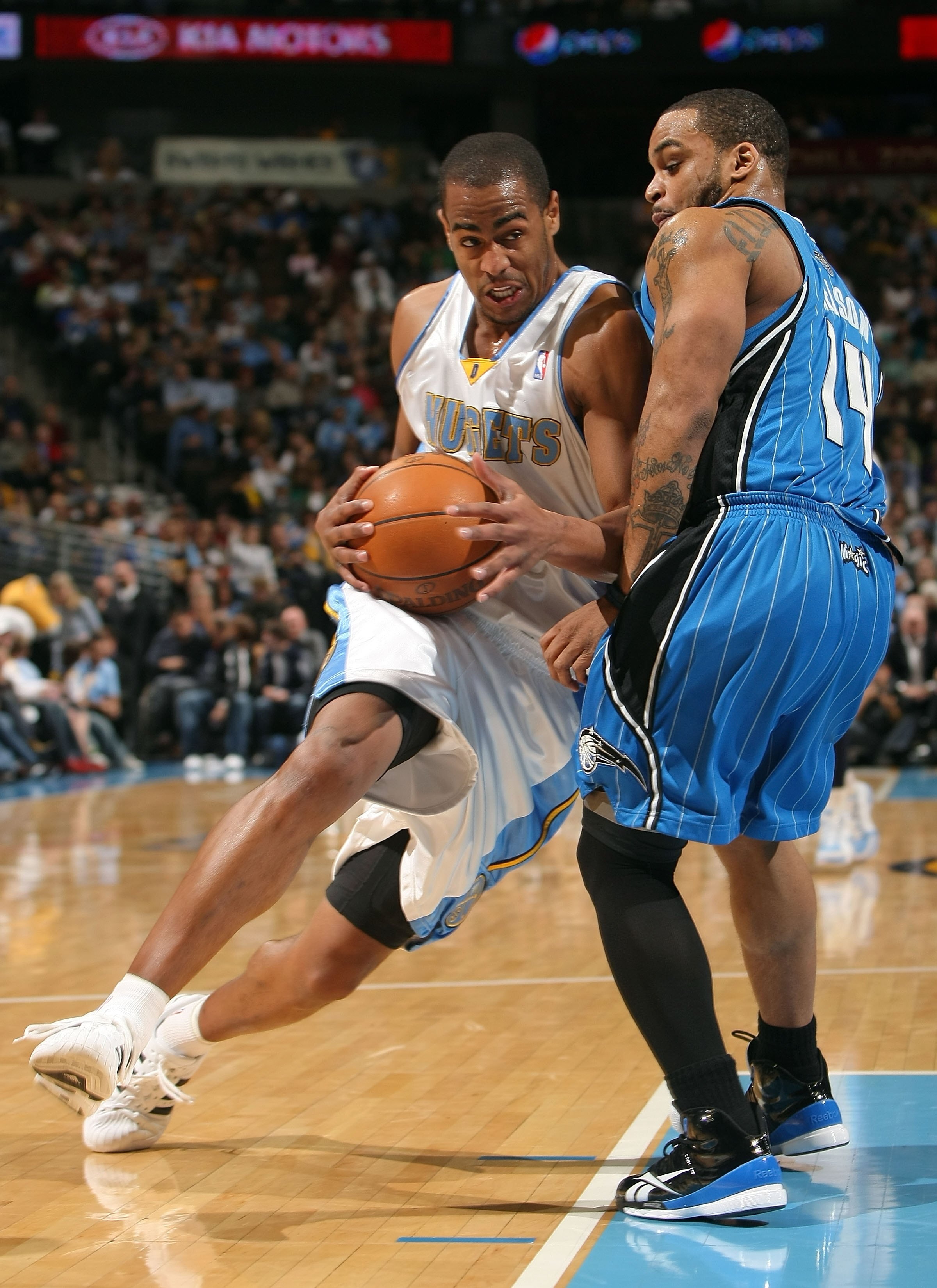 DENVER - JANUARY 13:  Arron Afflalo #6 of the Denver Nuggets drives with the ball against Jameer Nelson #14 of the Orlando Magic during NBA action at Pepsi Center on January 13, 2010 in Denver, Colorado. The Nuggets defeated the Magic 115-97. NOTE TO USER