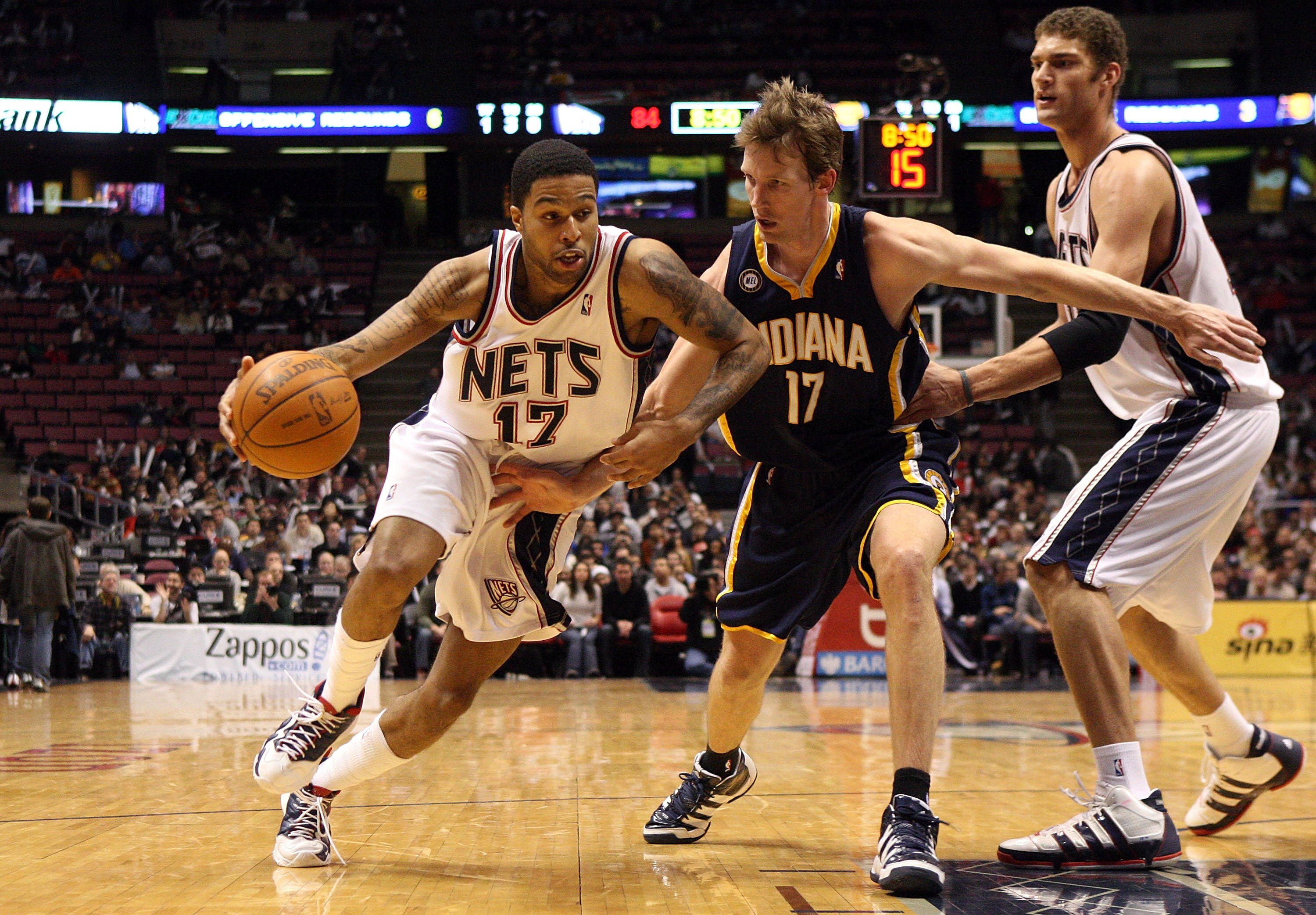 EAST RUTHERFORD, NJ - JANUARY 15:  Chris Douglas-Roberts #17 of the New Jersey Nets drives against Mike Dunleavy #17 of the Indiana Pacers at the Izod Center on January 15, 2010 in East Rutherford, New Jersey. NOTE TO USER: User expressly acknowledges and