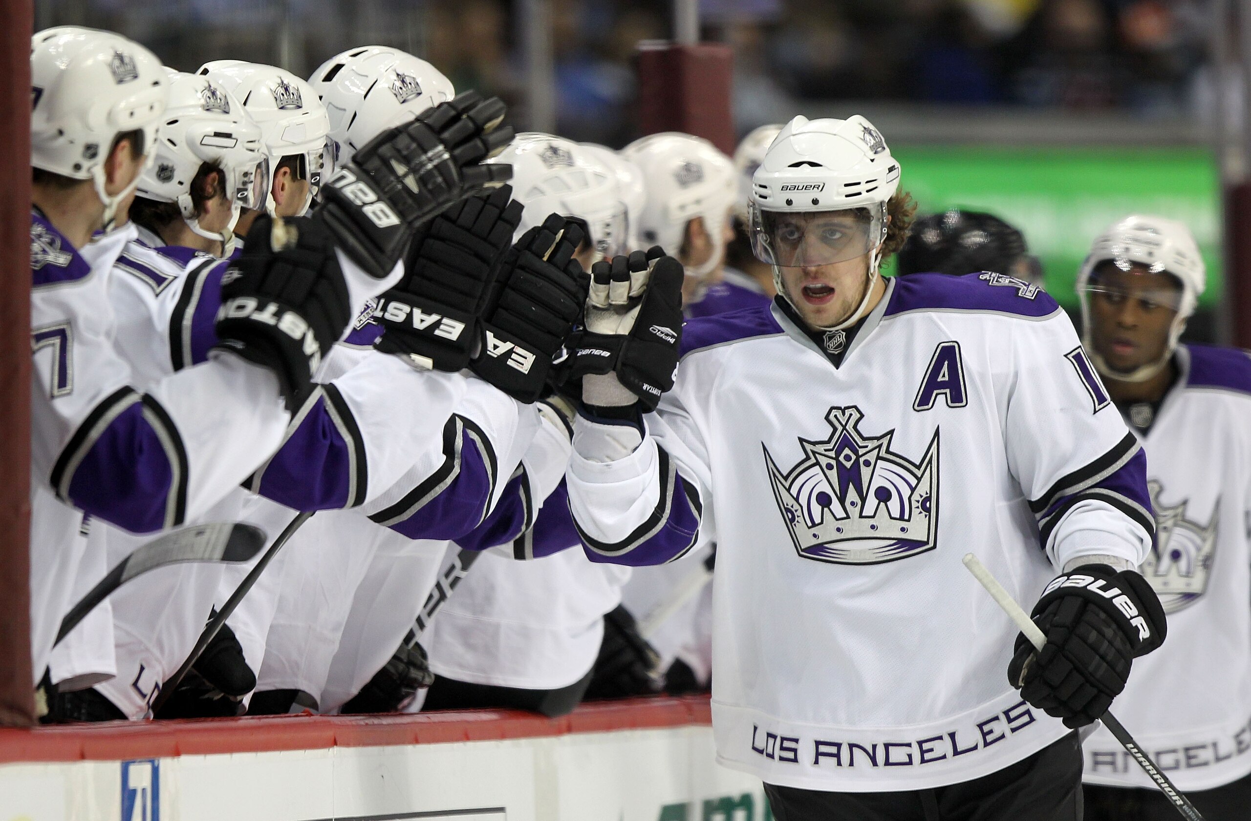 DENVER - MARCH 24:  Anze Kopitar #11 of the Los Angeles Kings is congratulated by his bench for his first period goal against the Colorado Avalanche during NHL action at the Pepsi Center on March 24, 2010 in Denver, Colorado.  (Photo by Doug Pensinger/Get