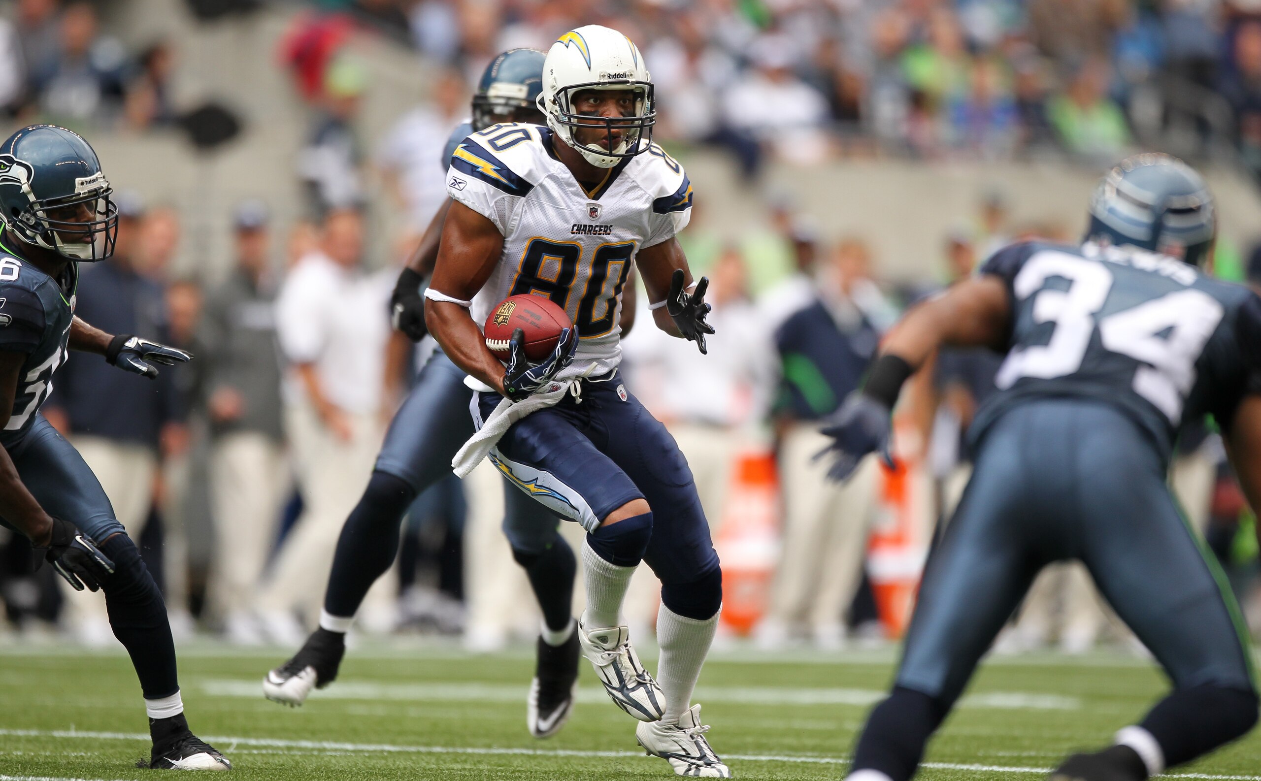 SEATTLE - SEPTEMBER 26:  Wide receiver Malcom Floyd #80 of the San Diego Chargers rushes against the Seattle Seahawks at Qwest Field on September 26, 2010 in Seattle, Washington. (Photo by Otto Greule Jr/Getty Images)